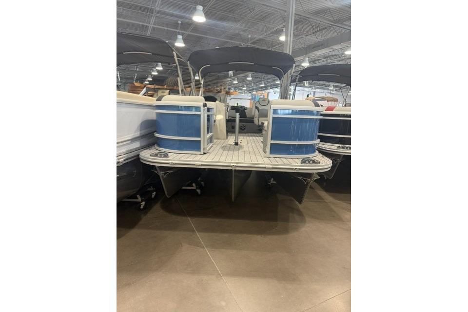 2026 SunCatcher Select 322SL pontoon boat displayed indoors, featuring blue accents.
