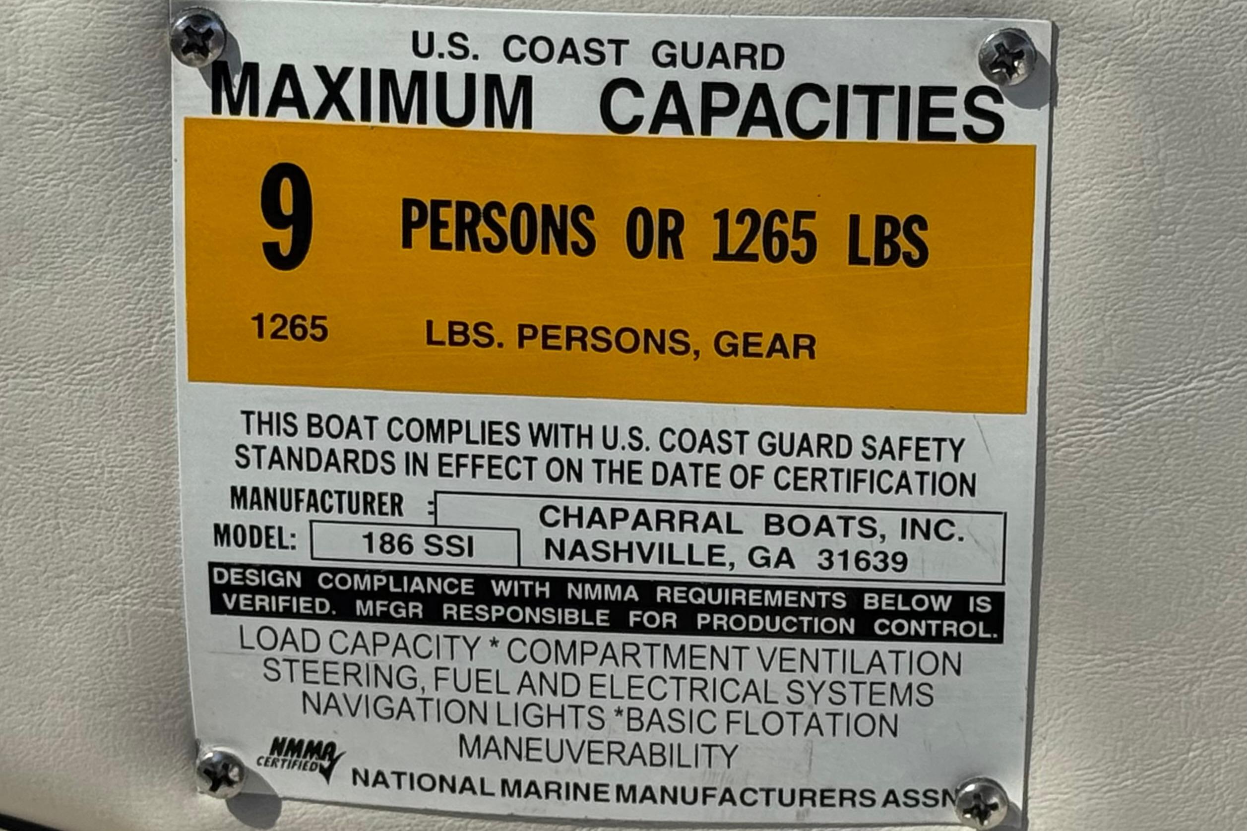 2002 Chaparral 186 SSi boat capacity label, 9 persons or 1265 lbs, U.S. Coast Guard compliant.