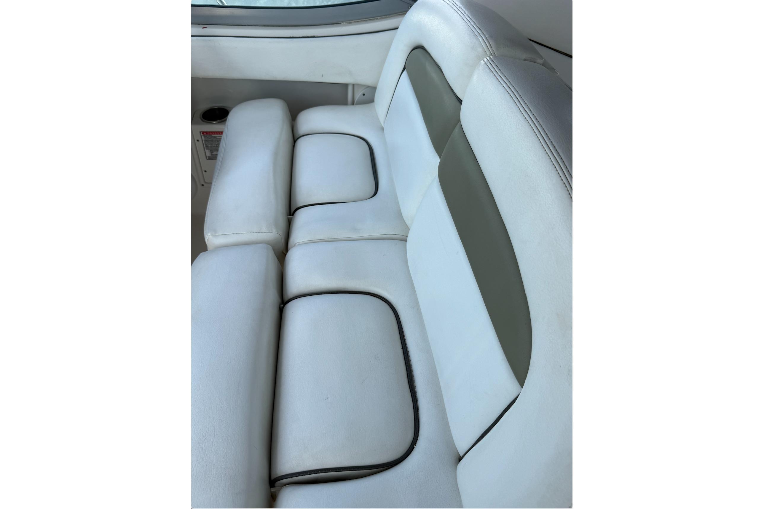 White leather seating on a 2006 Sea Ray 300 Sundancer boat.