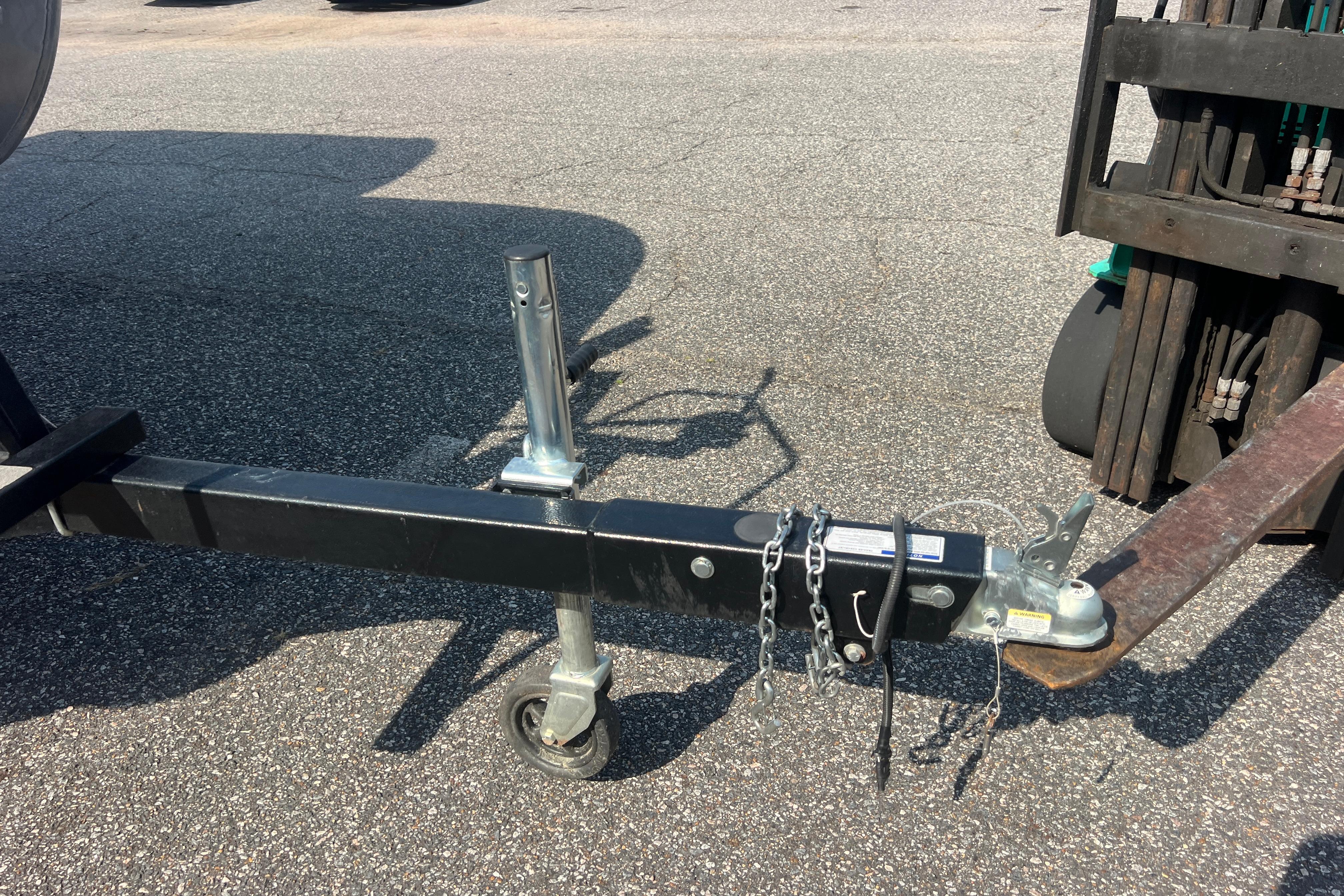 Trailer hitch of a 2022 Viaggio Lago V-U 22 on asphalt surface.