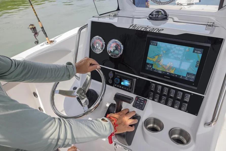 2025 Hurricane Center Console 24 OB dashboard with navigation screen and controls.