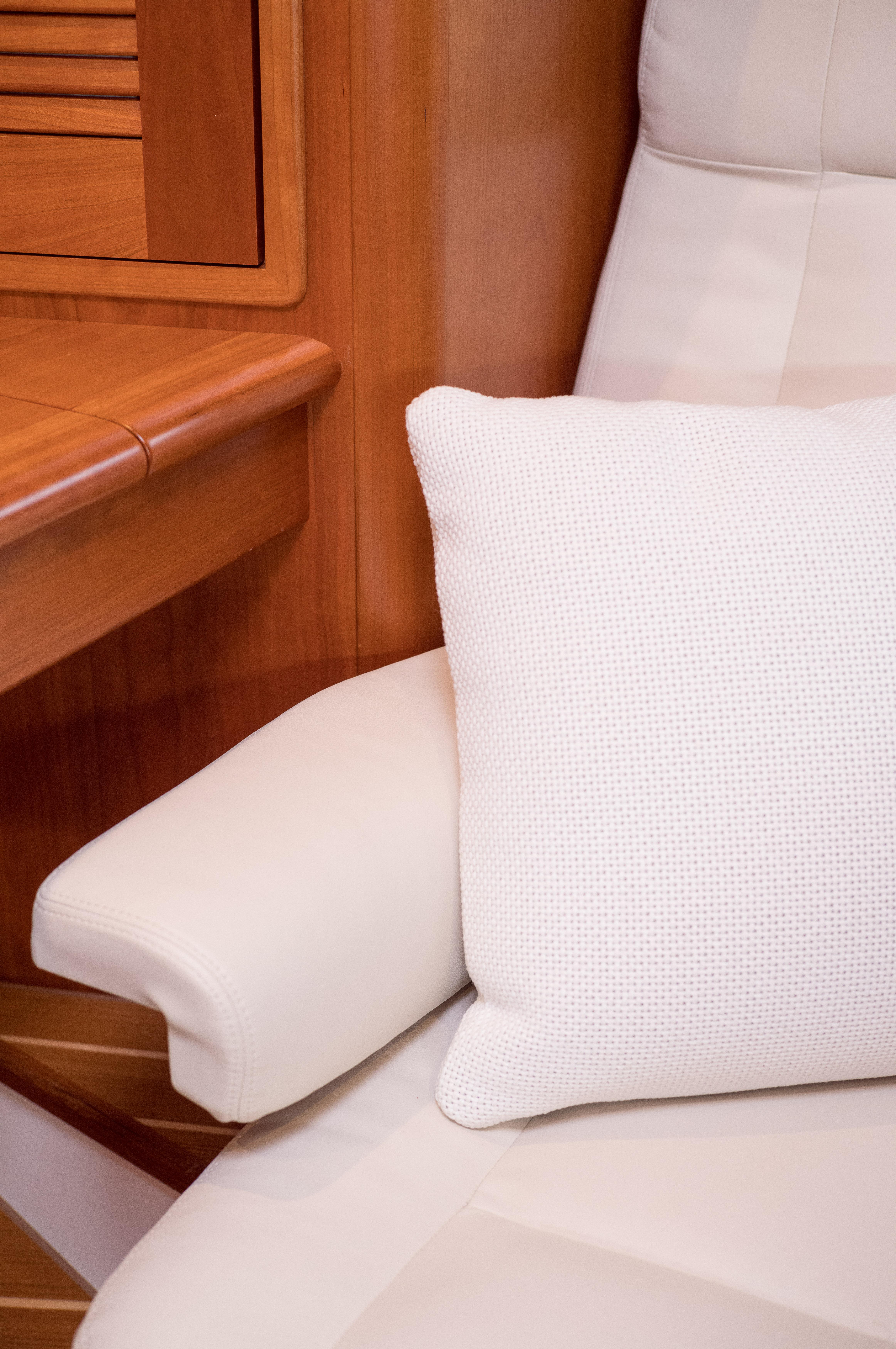 Luxurious interior of 2020 MJM 53z yacht with plush seating and cushion.