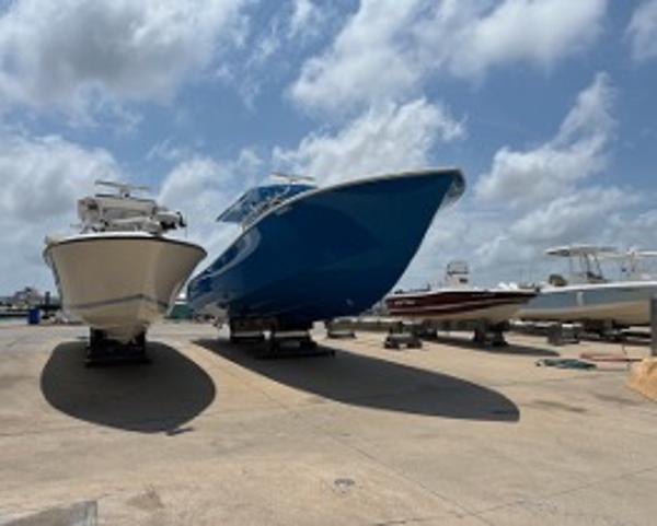 2022 Yellowfin 39 Offshore boat on display under a cloudy sky.