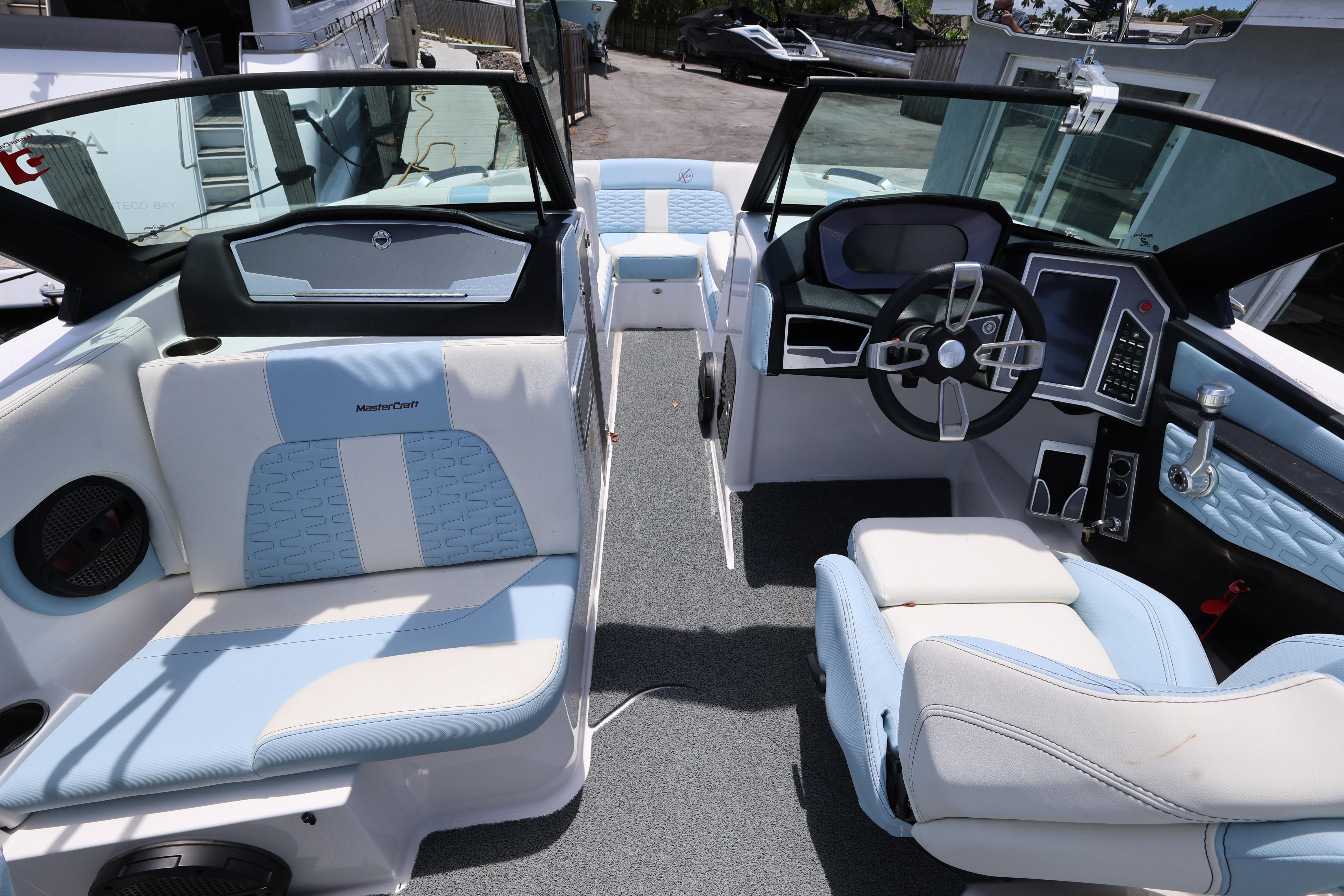 2023 MasterCraft X24 boat interior with modern dashboard and seating.