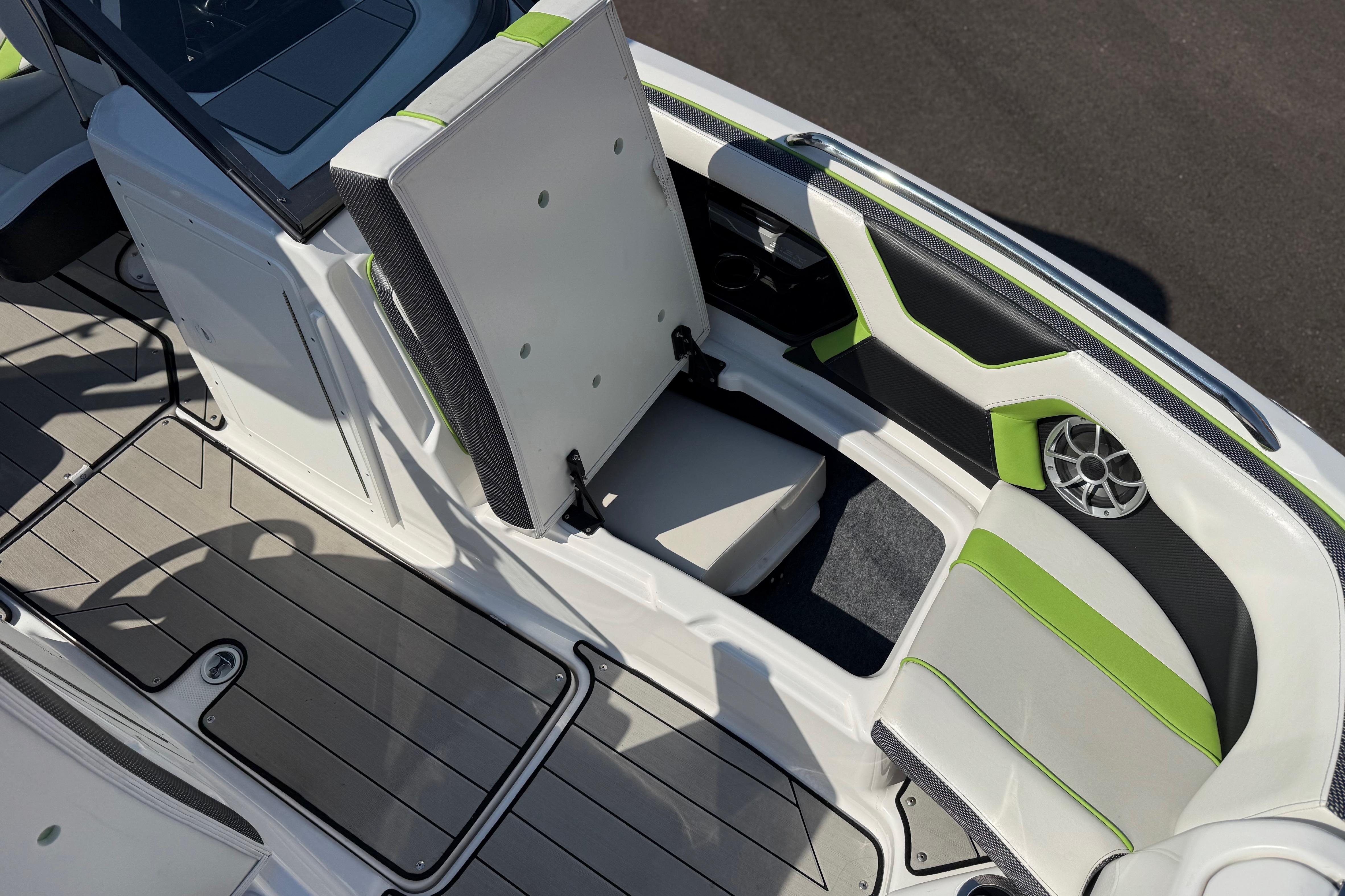 2022 Yamaha Boats 212XE interior with green-accented seating and speaker system.