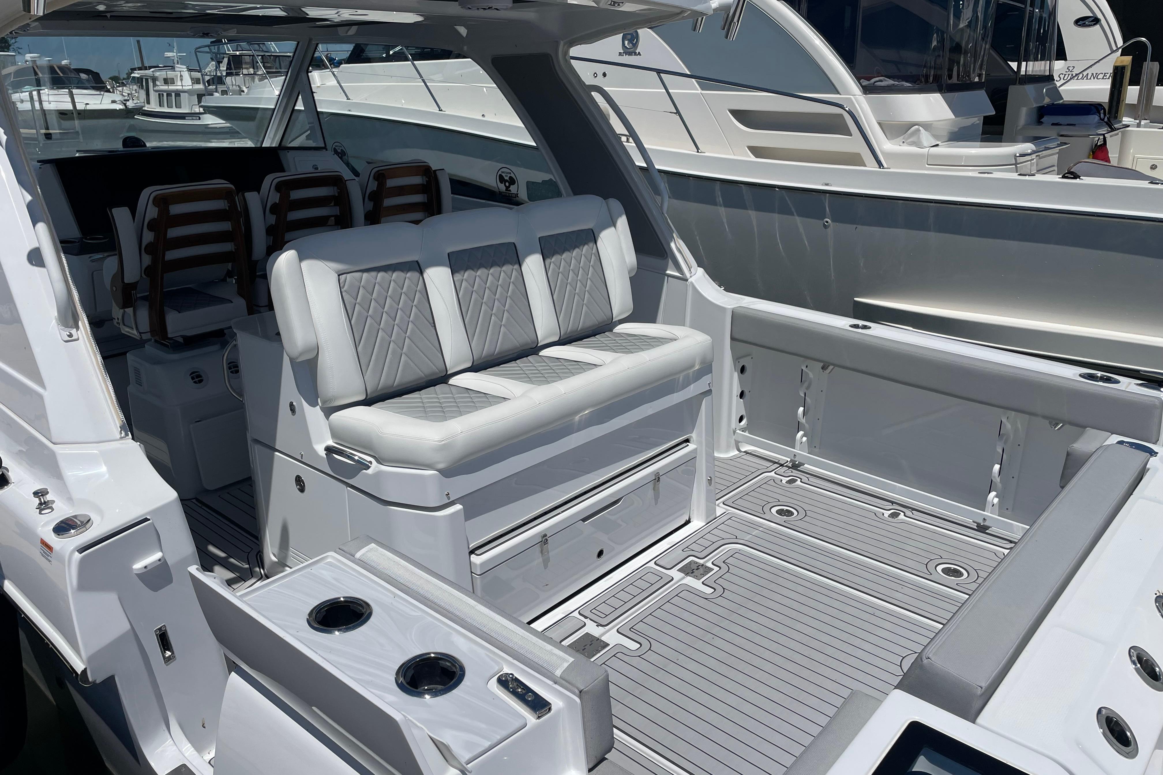 Luxurious 2026 Everglades 367CX boat interior with plush seating and sleek design.