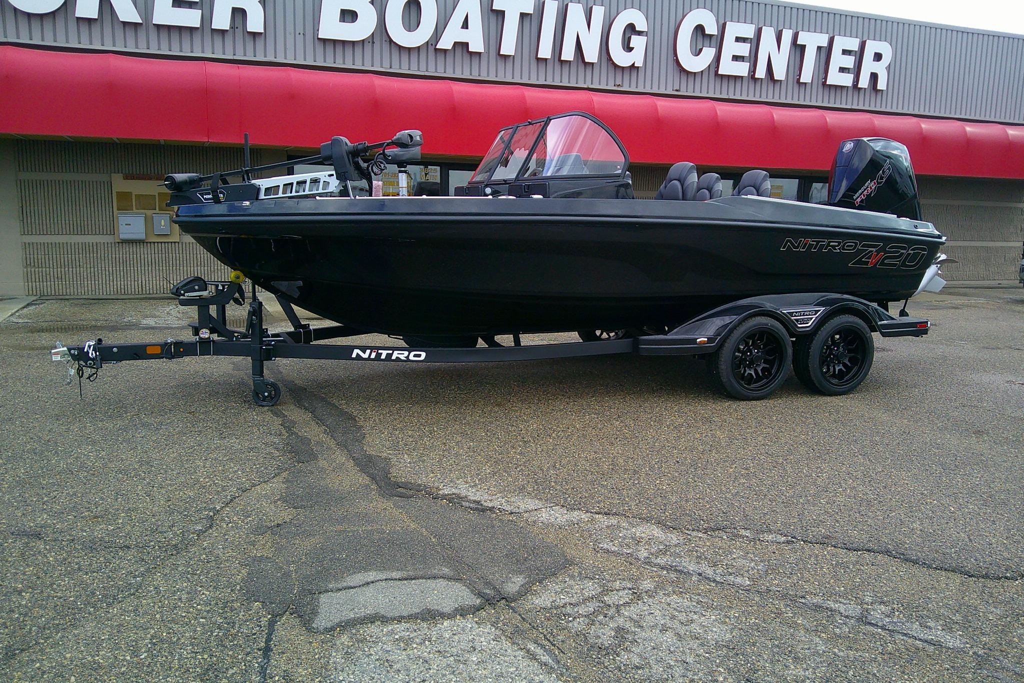 2026 Nitro ZV20 boat on trailer outside a boating center.