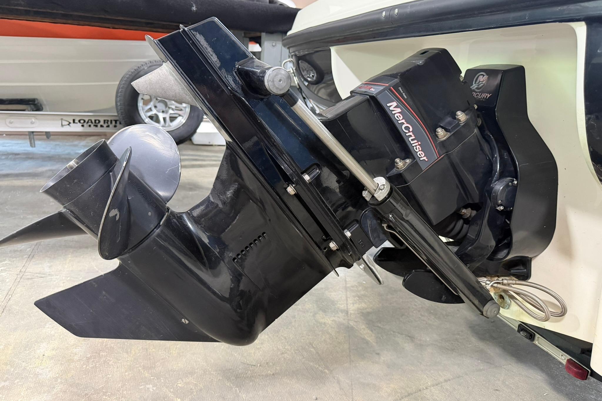 2012 Bayliner 175 Bowrider with MerCruiser engine, showcasing the outdrive and propeller.