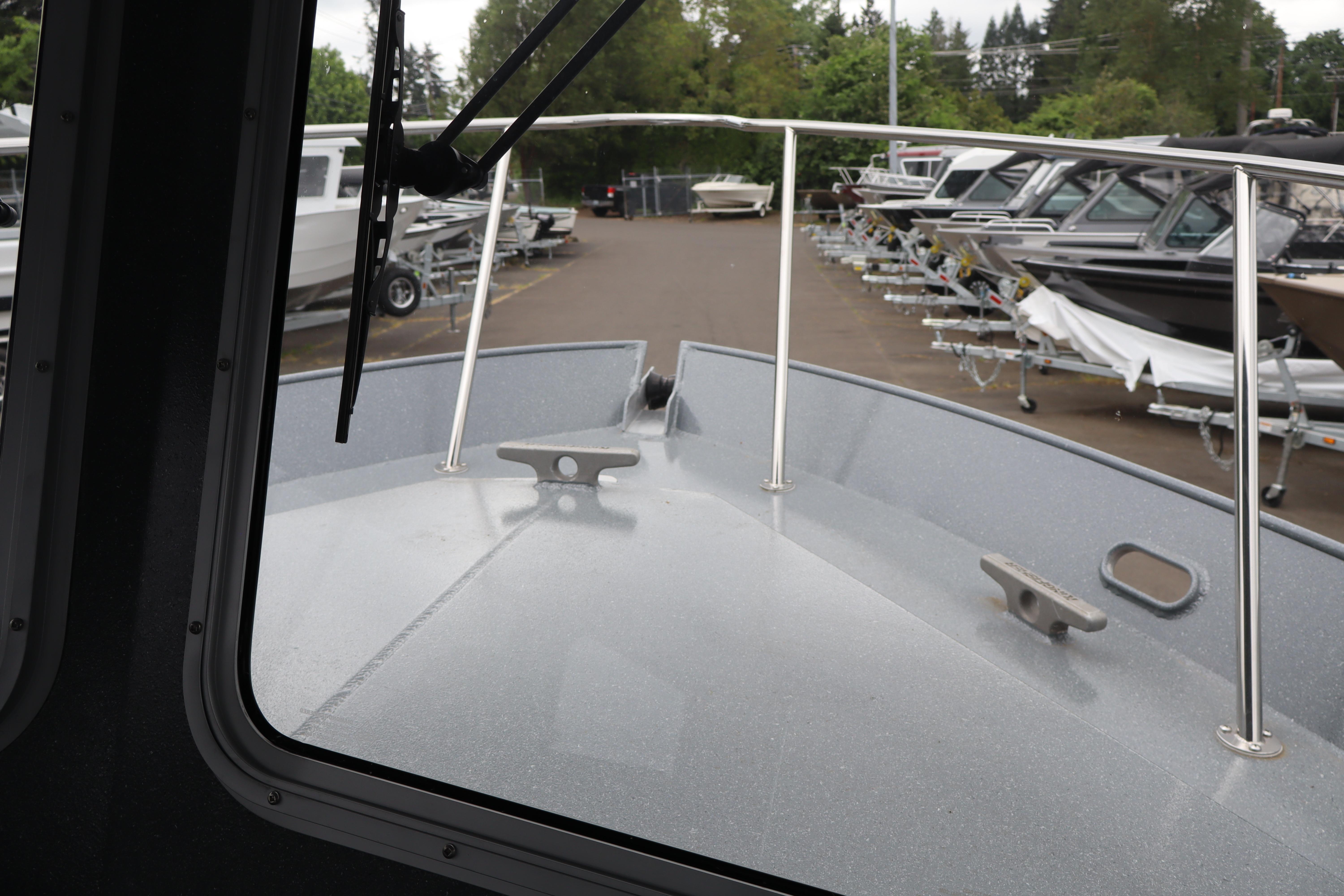 2026 KingFisher 2825 Coastal Express boat view from cabin, docked with other boats.