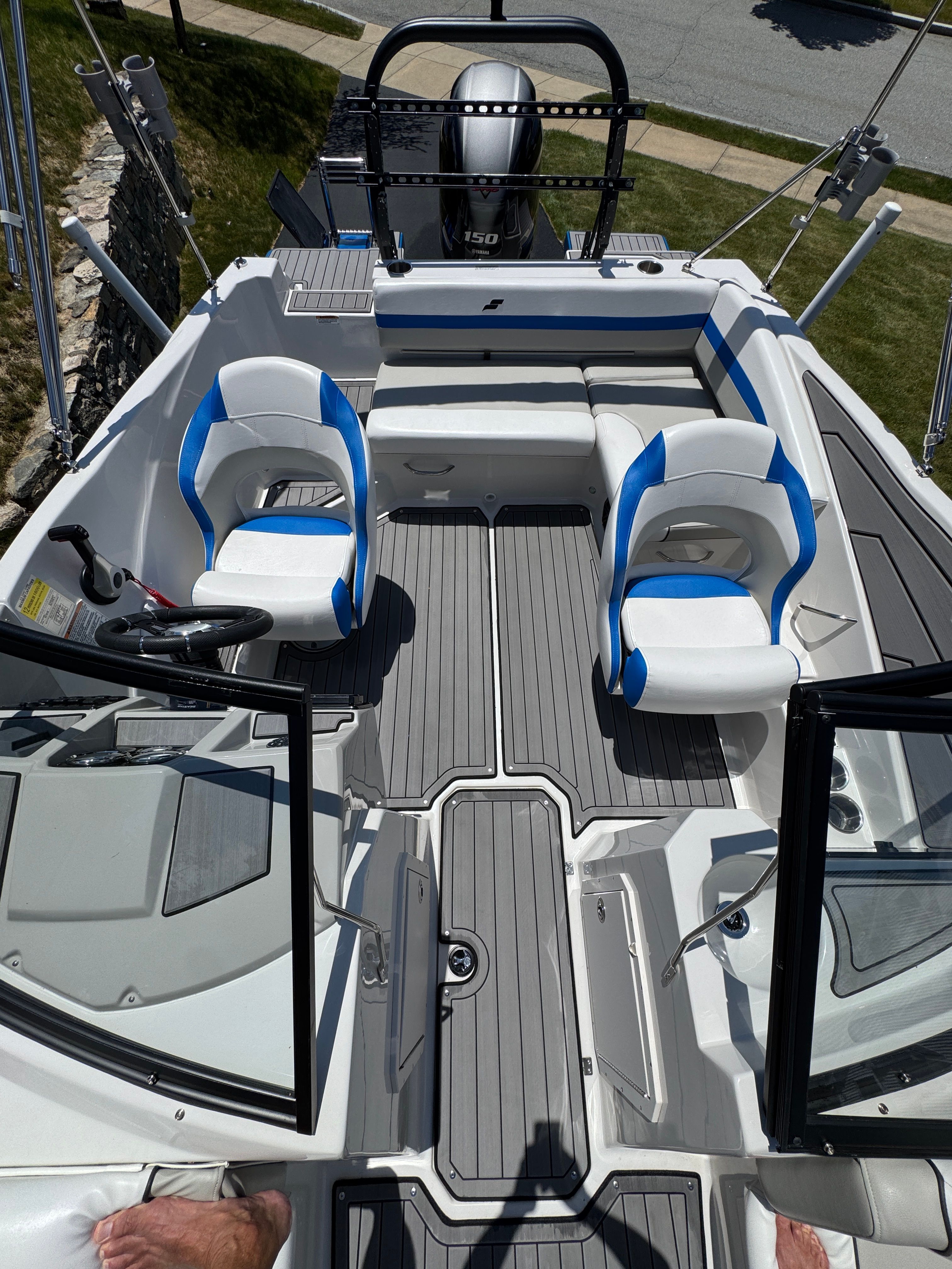 Interior view of a 2023 Starcraft SVX 190 OB boat with blue seats.