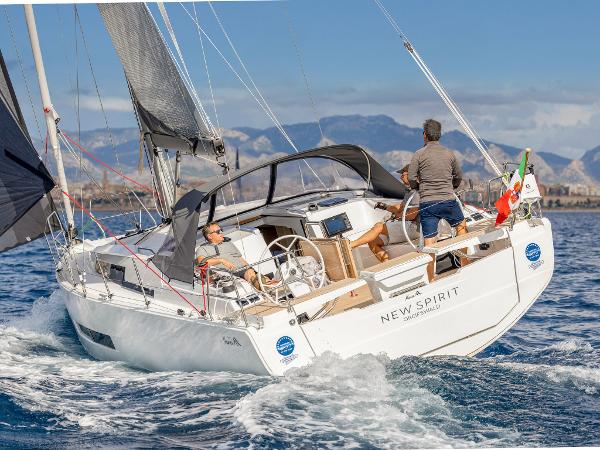 Sailing yacht Hanse 360 #41, 2025 model, cruising on open water with mountains in the background.