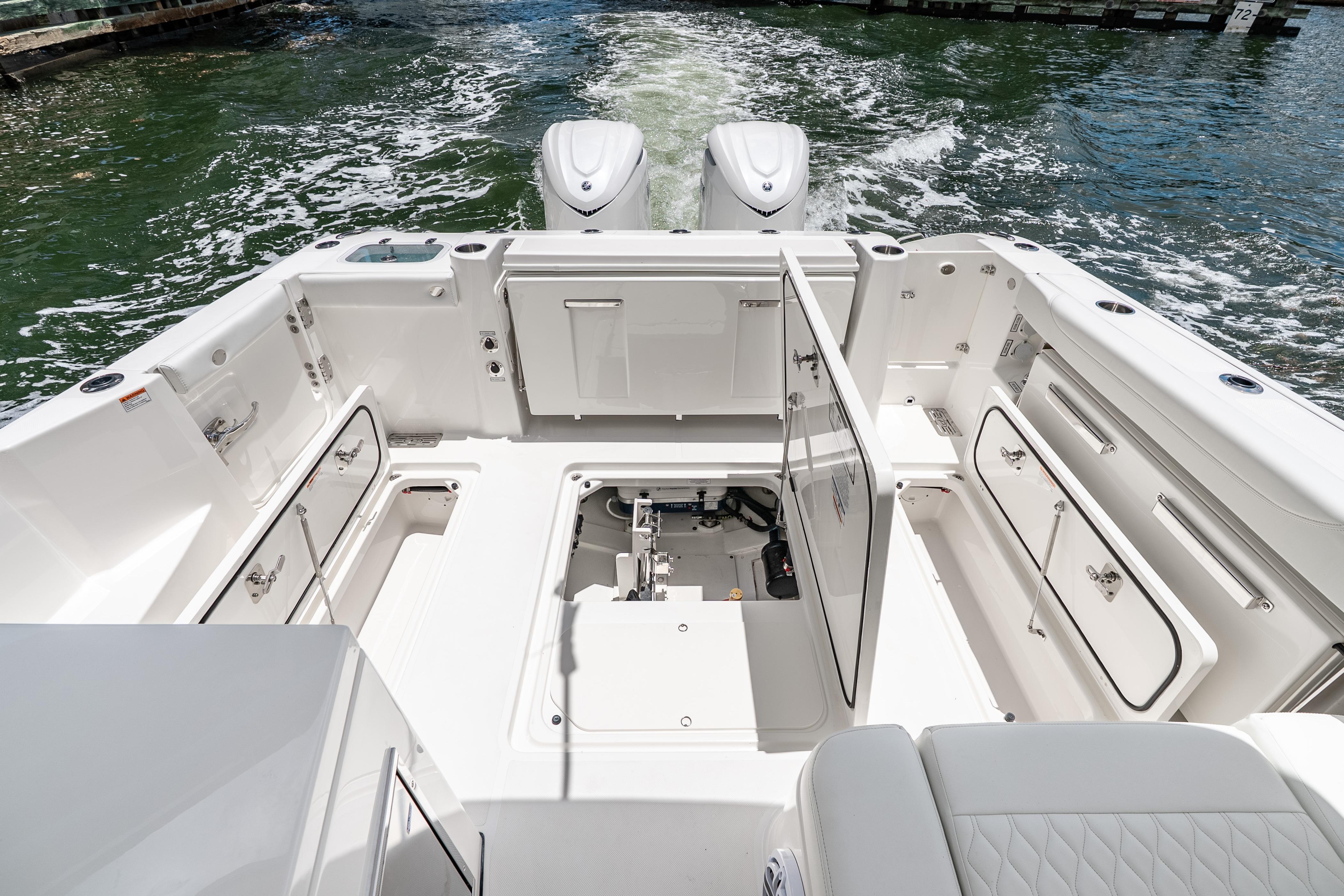2026 Pursuit DC 326 Dual Console boat interior with open storage compartments.