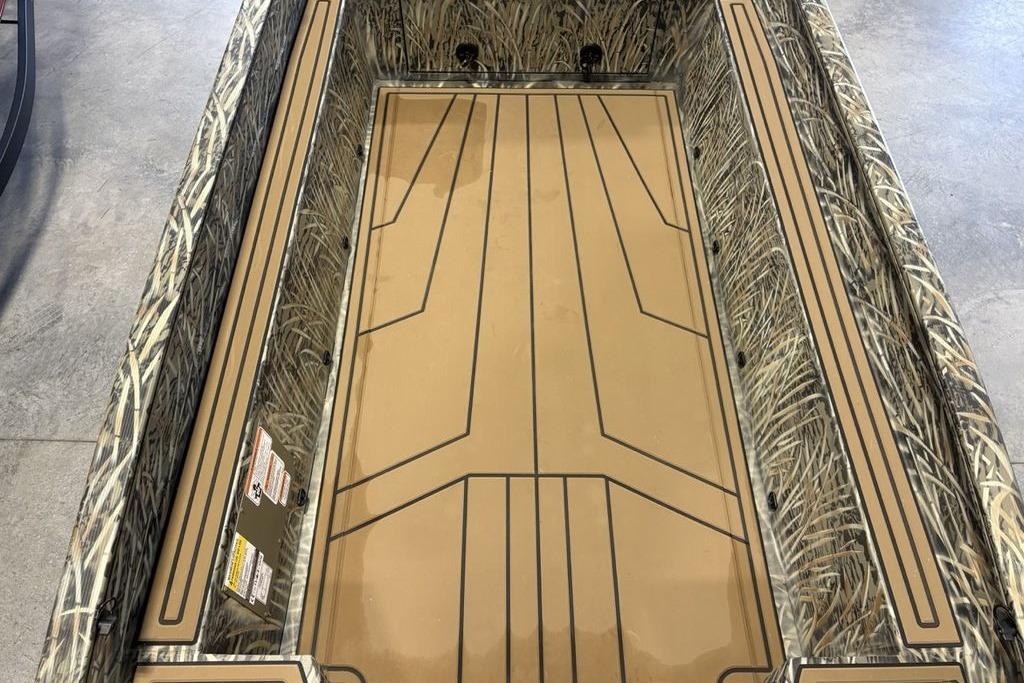 2026 Tracker Grizzly 1650 T Prairie Wings Edition boat interior with camouflage design.