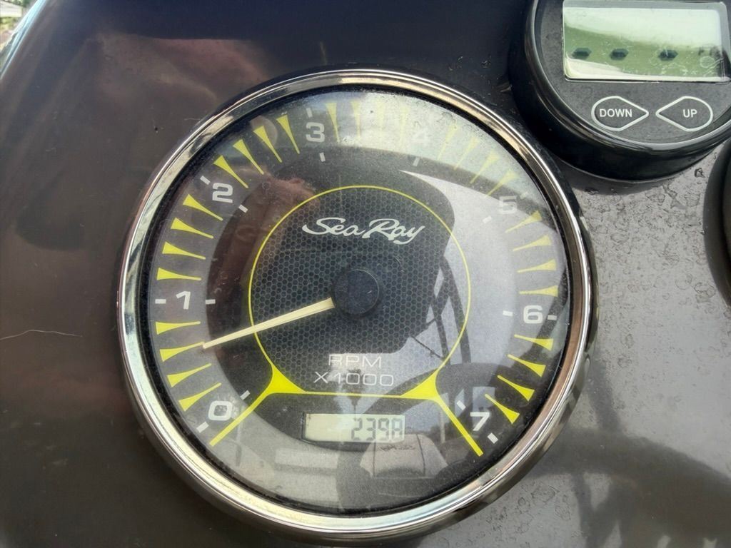 Close-up of a tachometer with Sea Ray logo, displaying 2398 RPM.