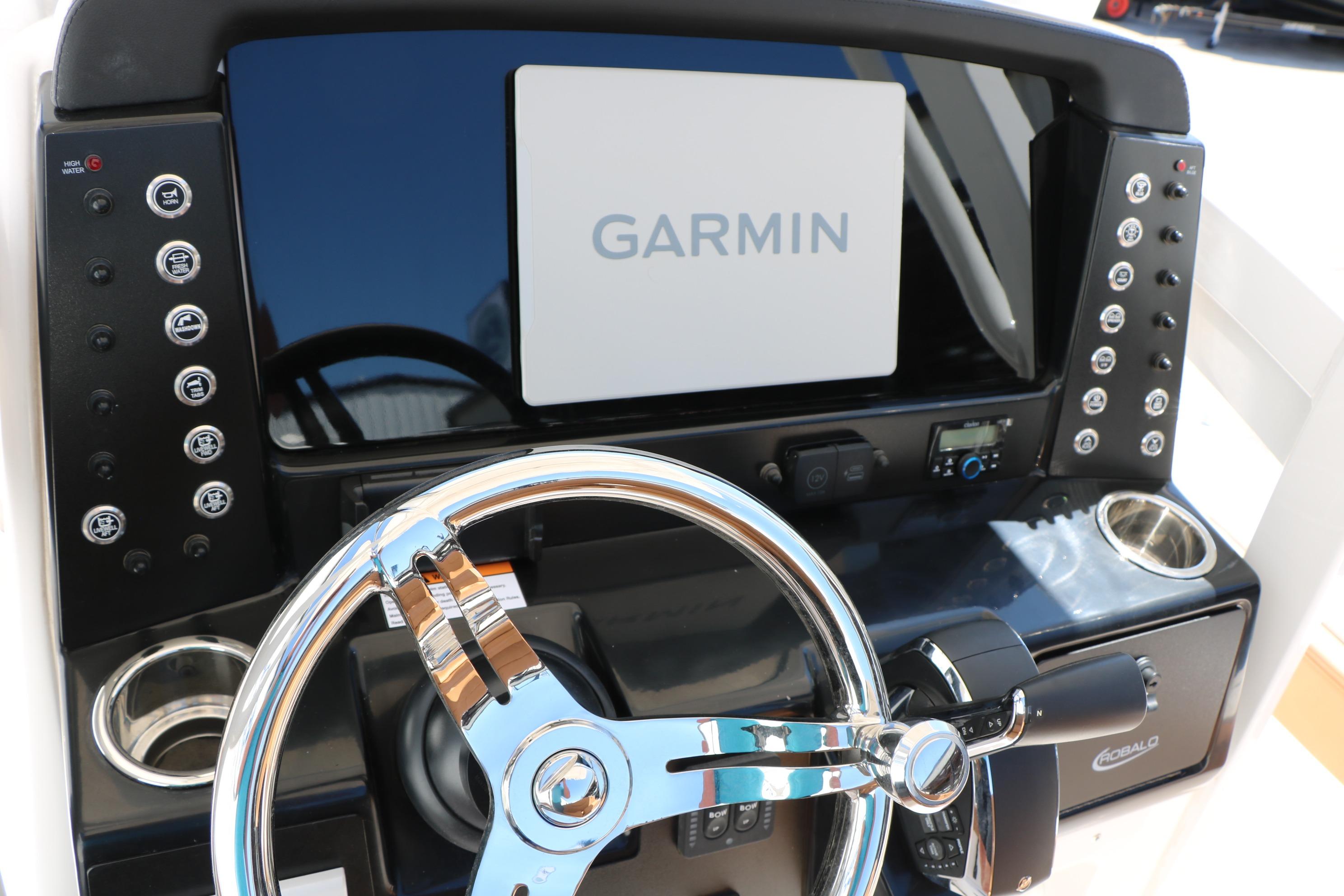 2026 Robalo 246 Cayman boat dashboard with Garmin display and steering wheel.