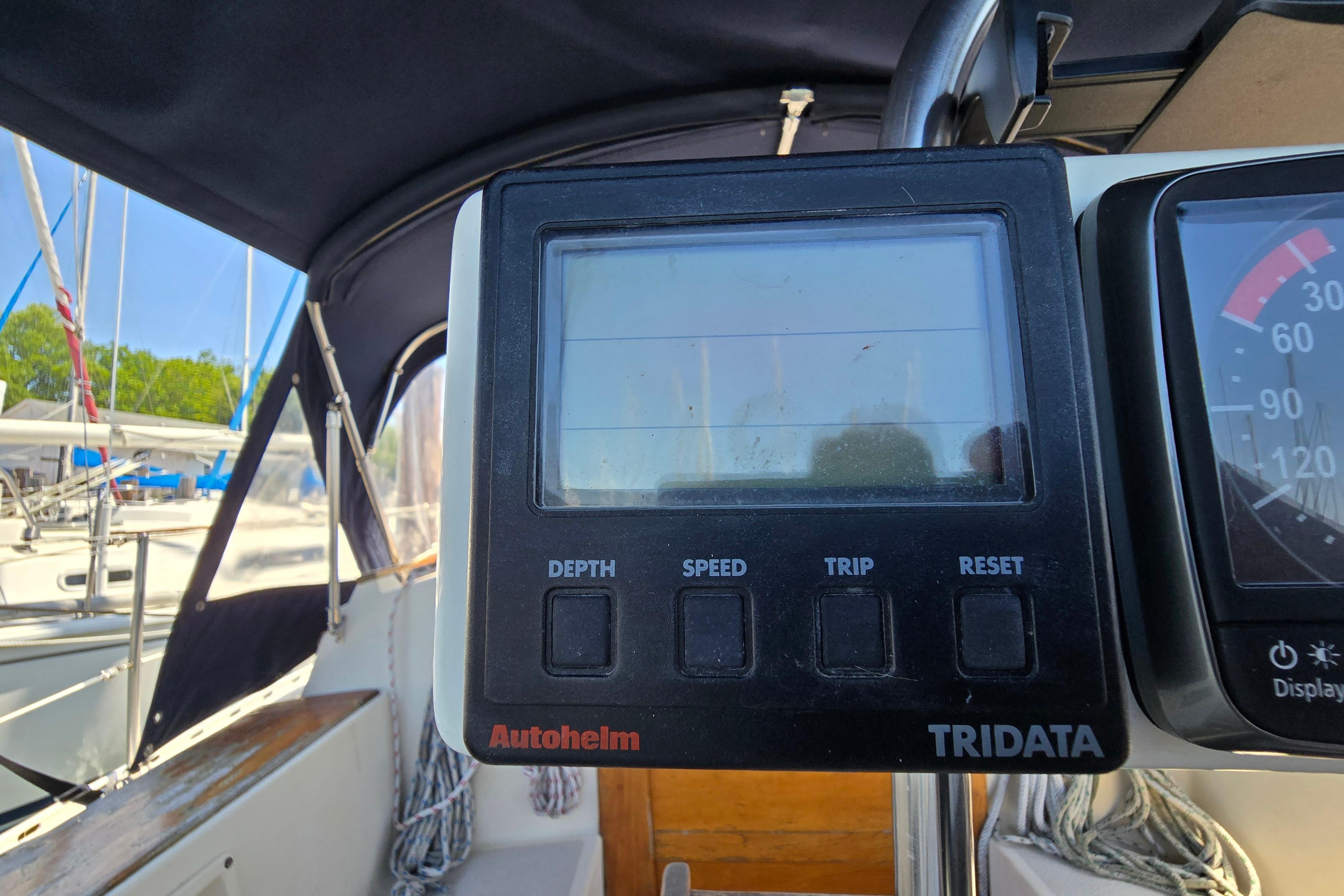 Cockpit view of a 1993 Caliber 35 sailboat with Autopilot Tridata display.