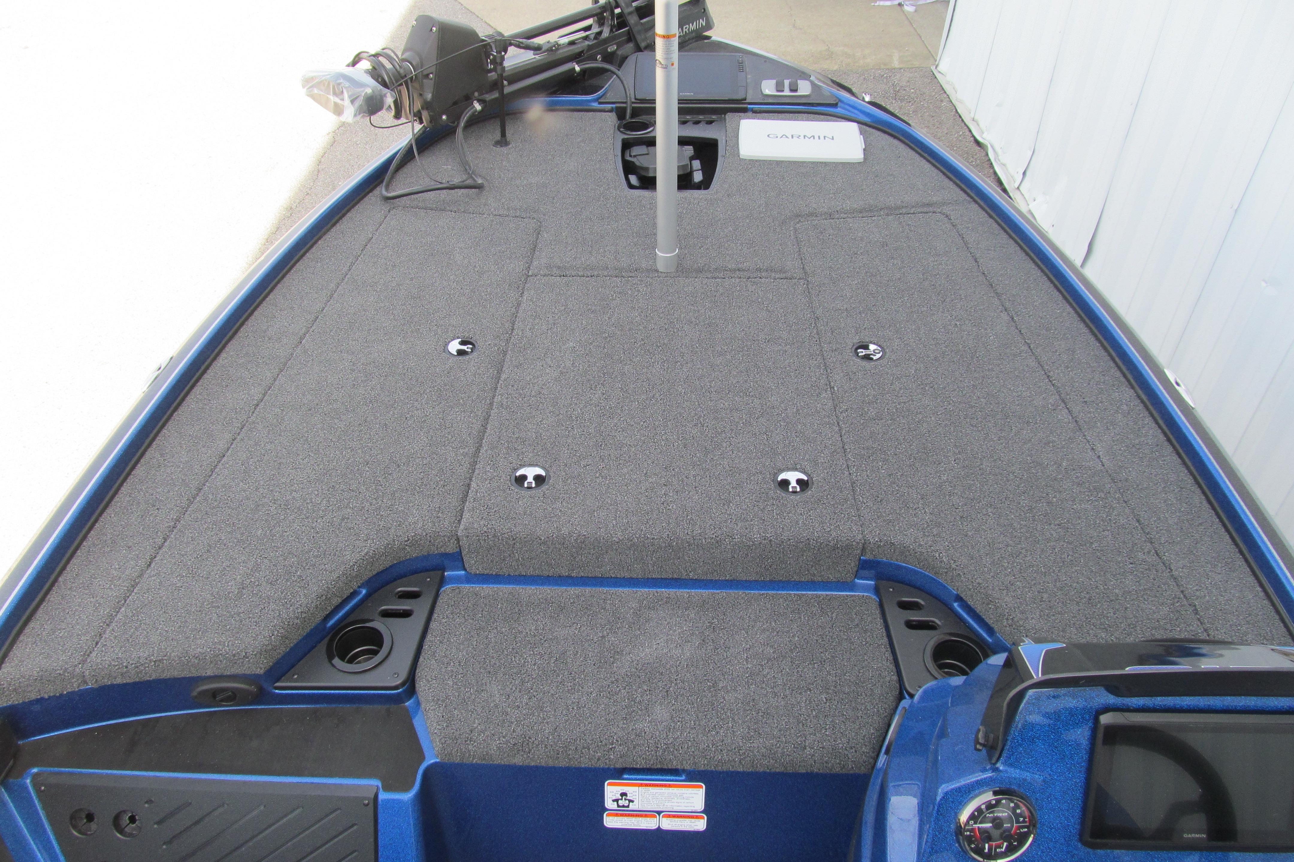 2026 Nitro Z18 Pro boat deck with carpeted surface and fishing equipment.