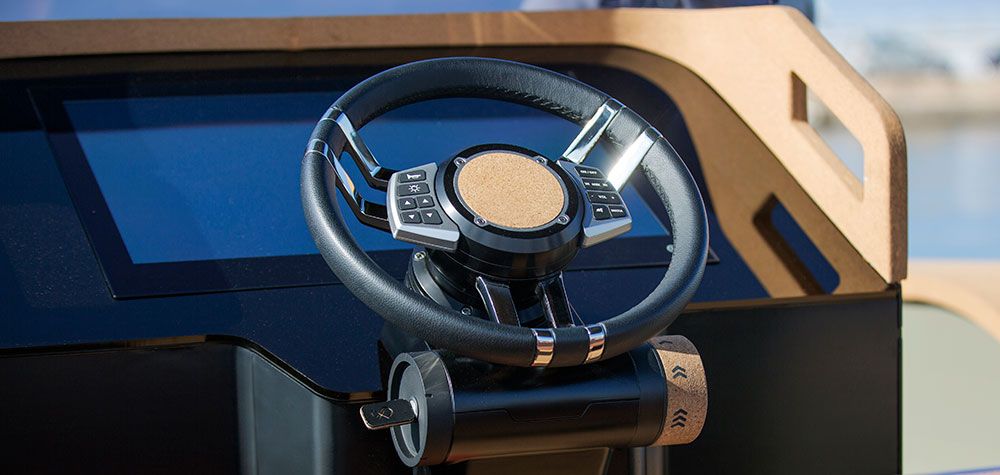 The image shows the steering wheel of a 2023 X Shore Eelex 8000 boat.
