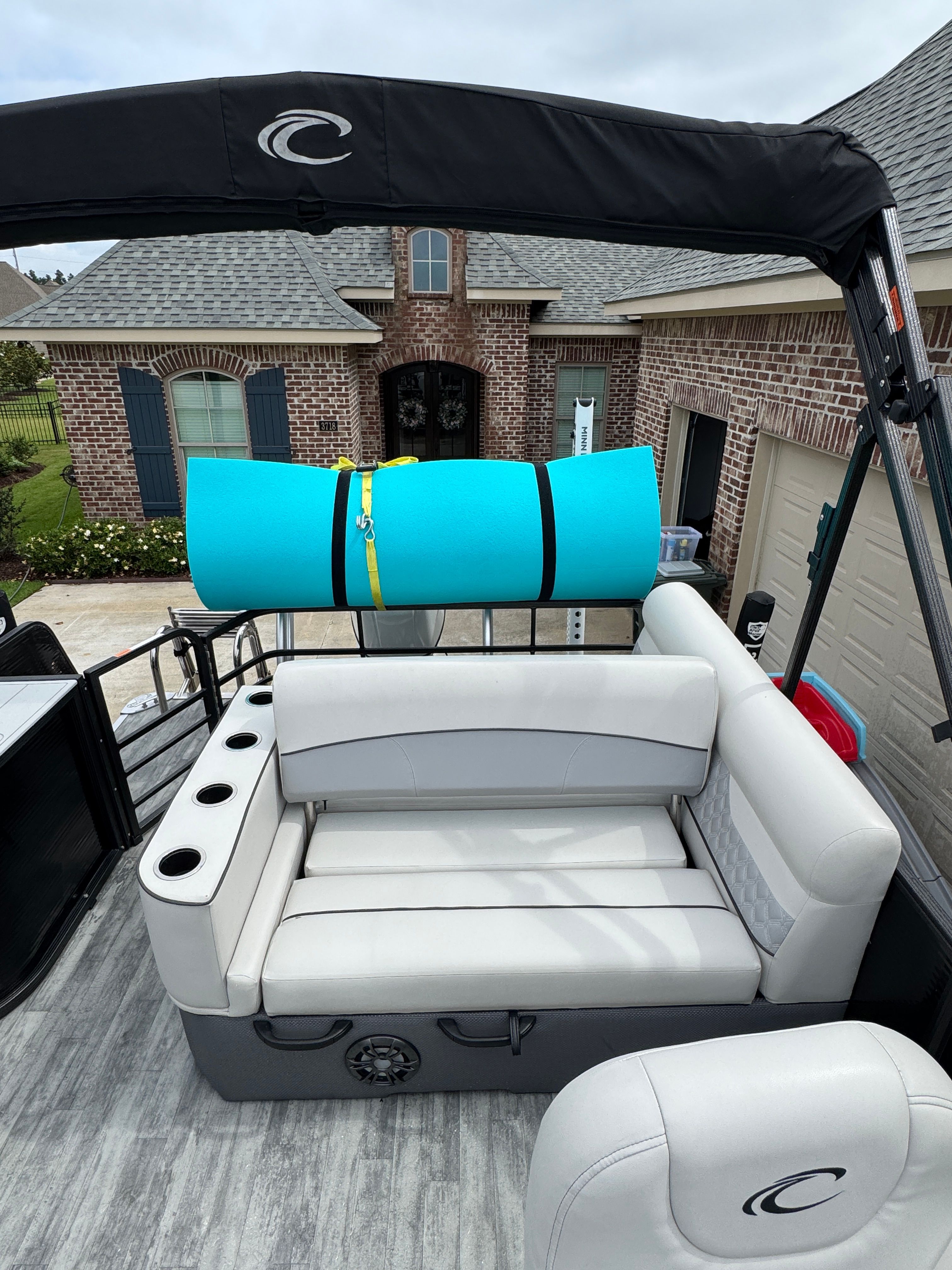 Crest Classic DLX 220 boat with seating and blue mat, 2022 model.