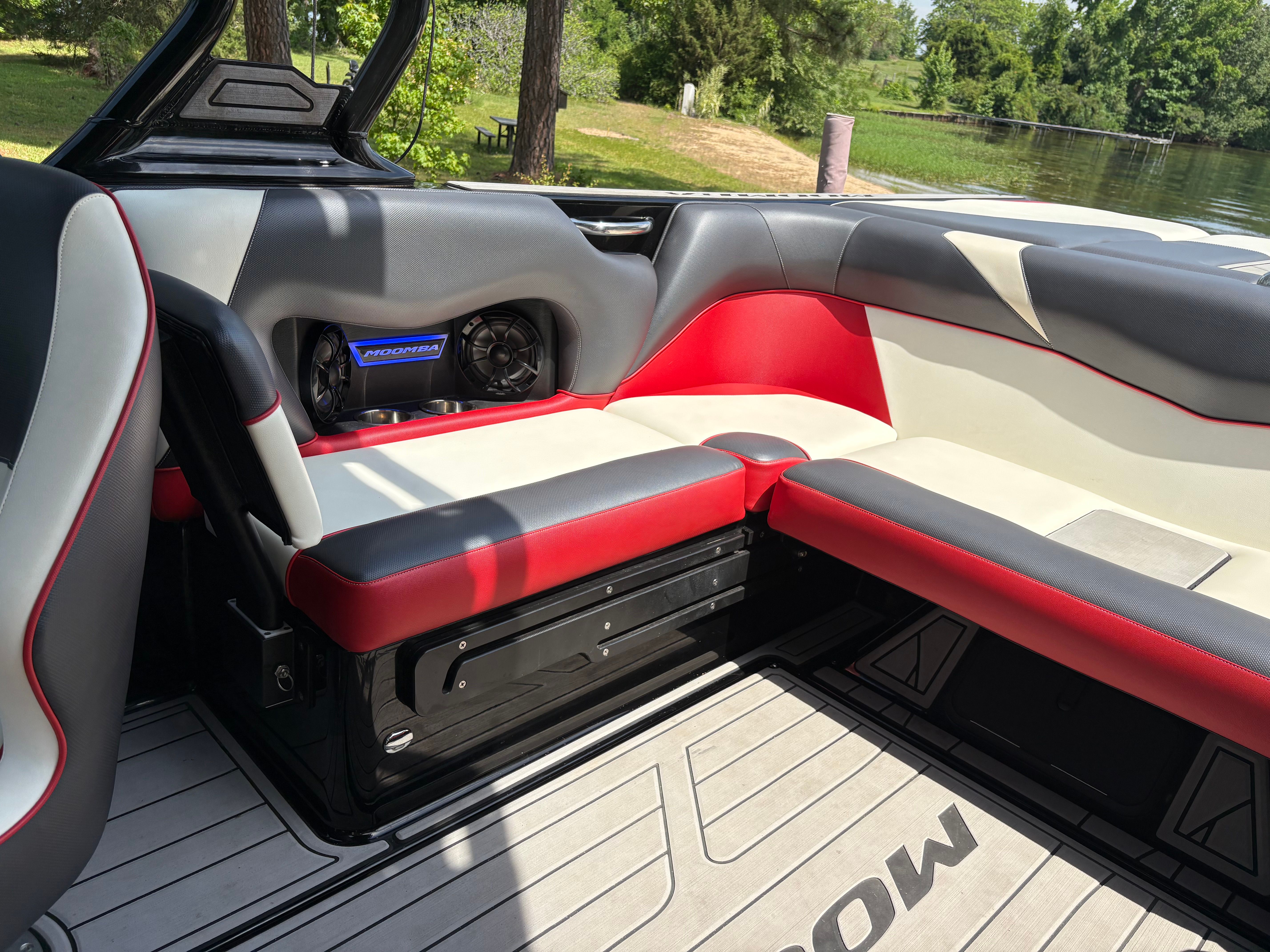 Interior of a 2021 Moomba Craz boat with red and gray seating.