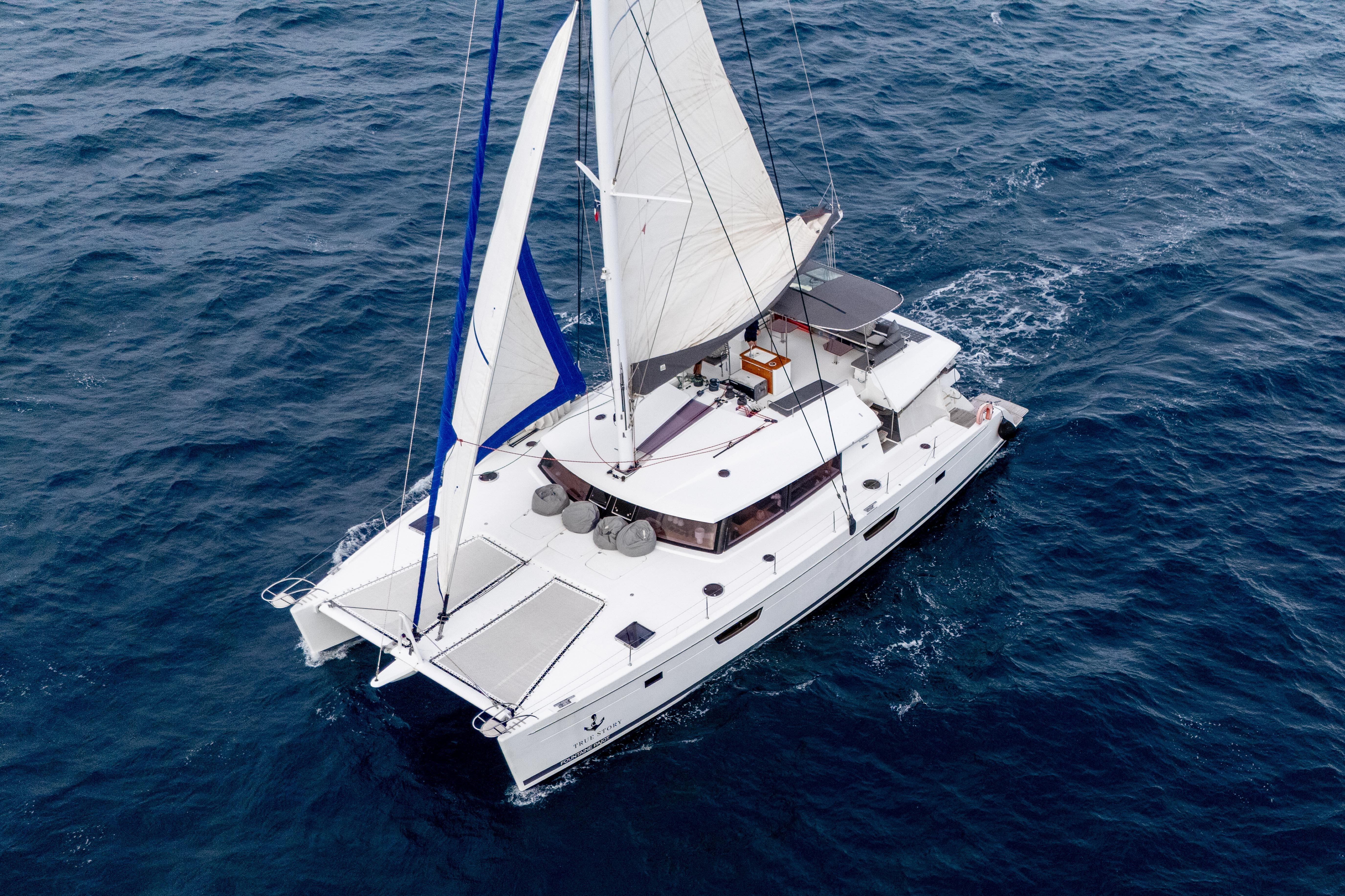 2017 Fountaine Pajot Victoria 67 sailing on open ocean waters.