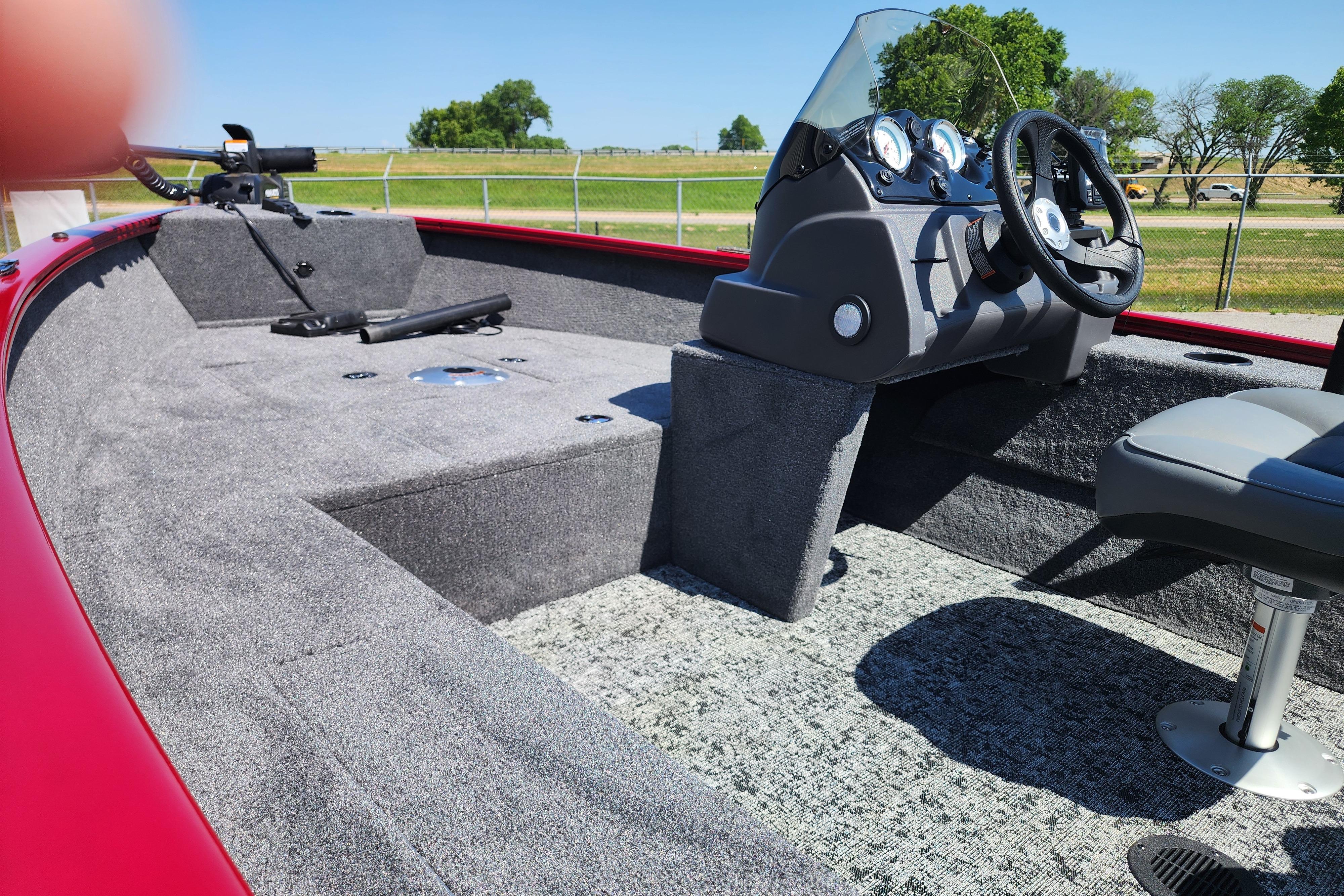 2026 Tracker Super Guide V-16 SC boat interior with steering console and seating.