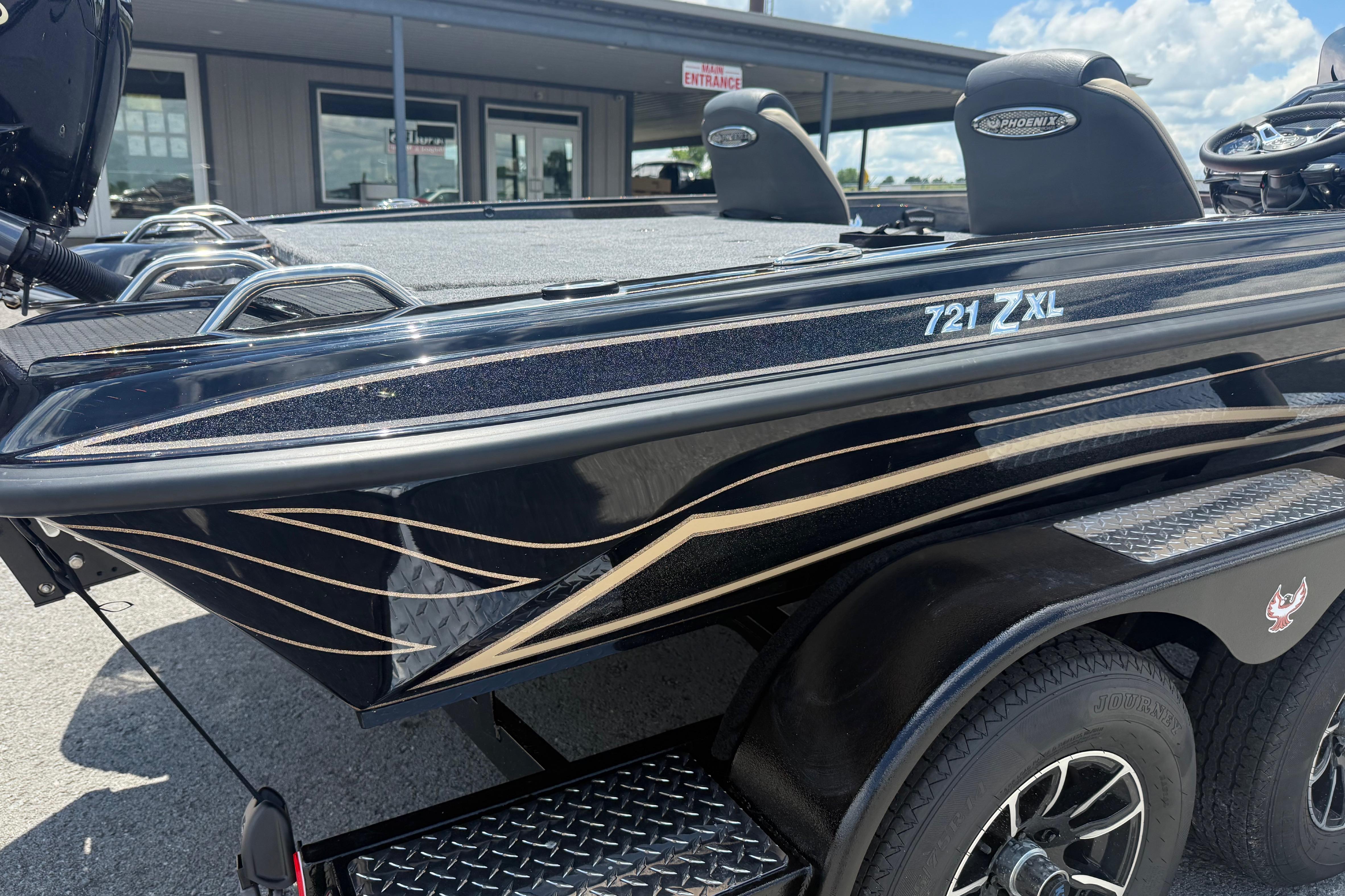 2027 Phoenix 721 ZXL boat with sleek black design and stylish graphics.