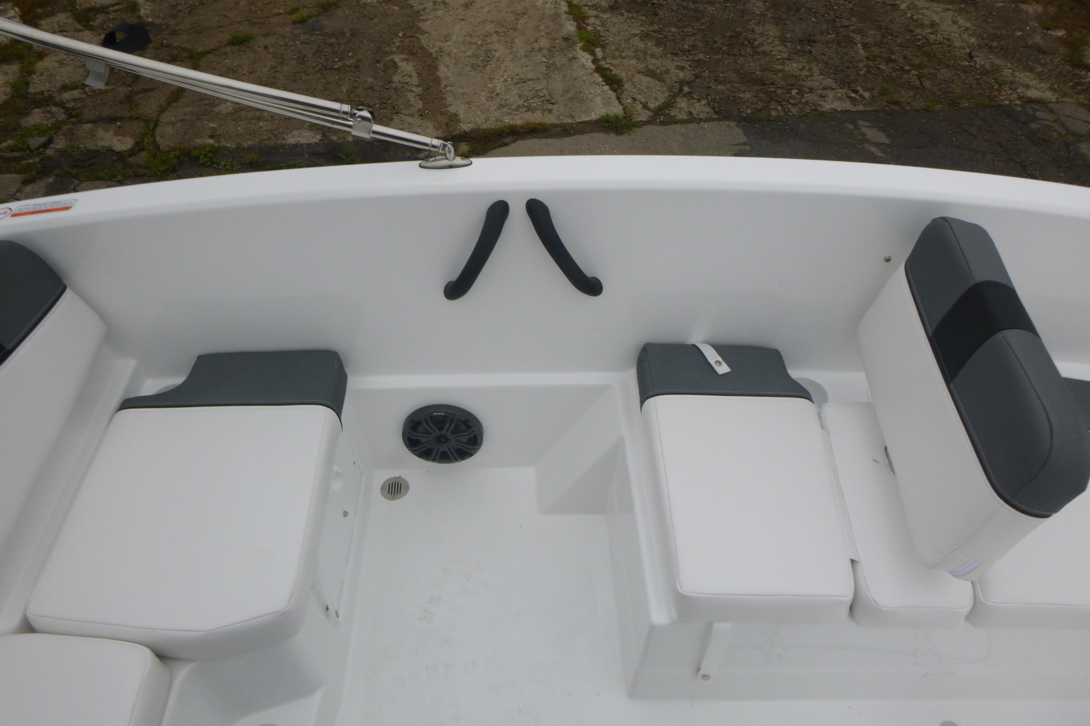 Interior seating of 2026 Tahoe T16 boat with white and gray cushions.