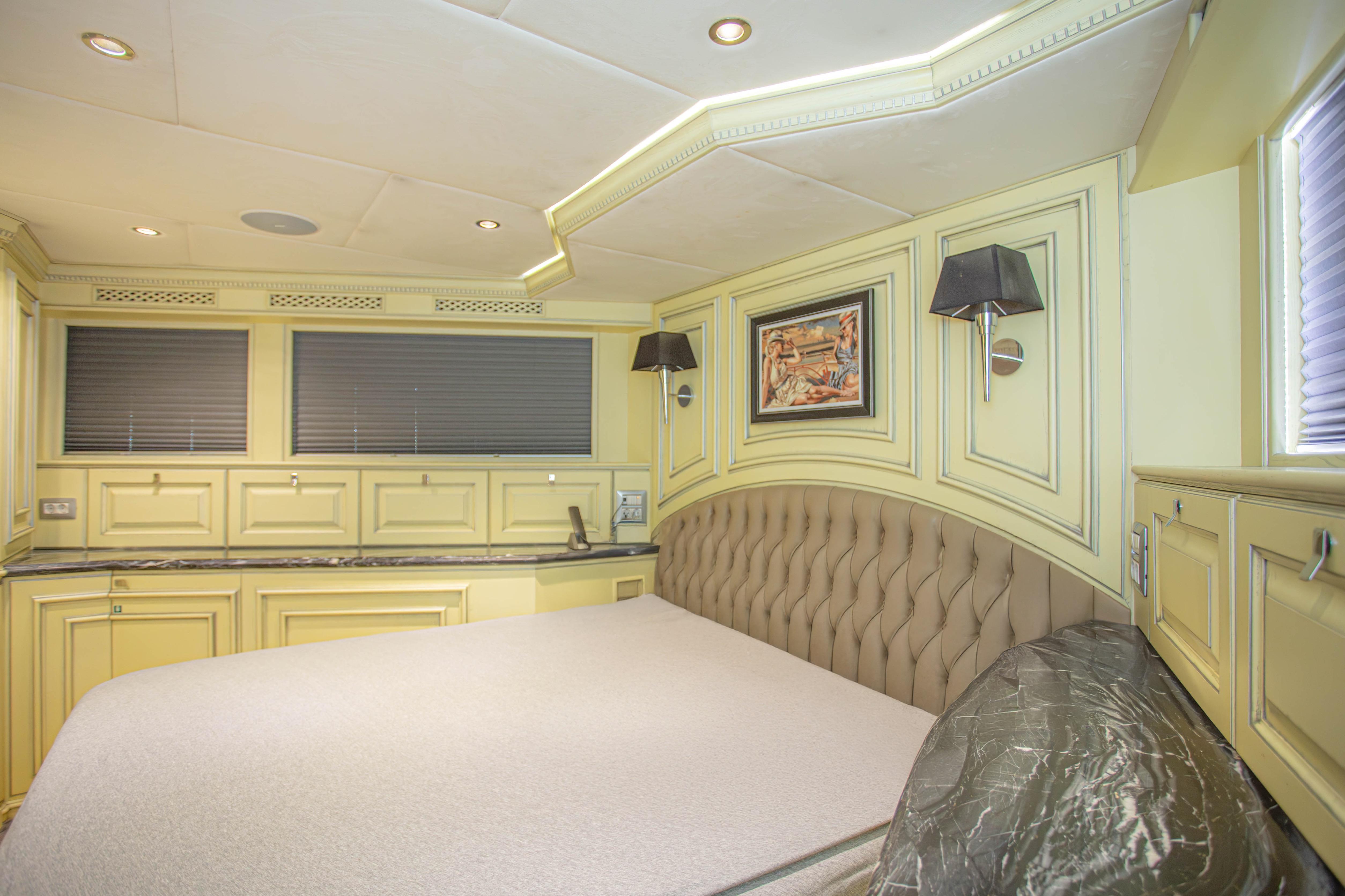 Luxurious bedroom interior on 2014 Fifth Ocean Yachts 24m Displacement Explorer Yacht.