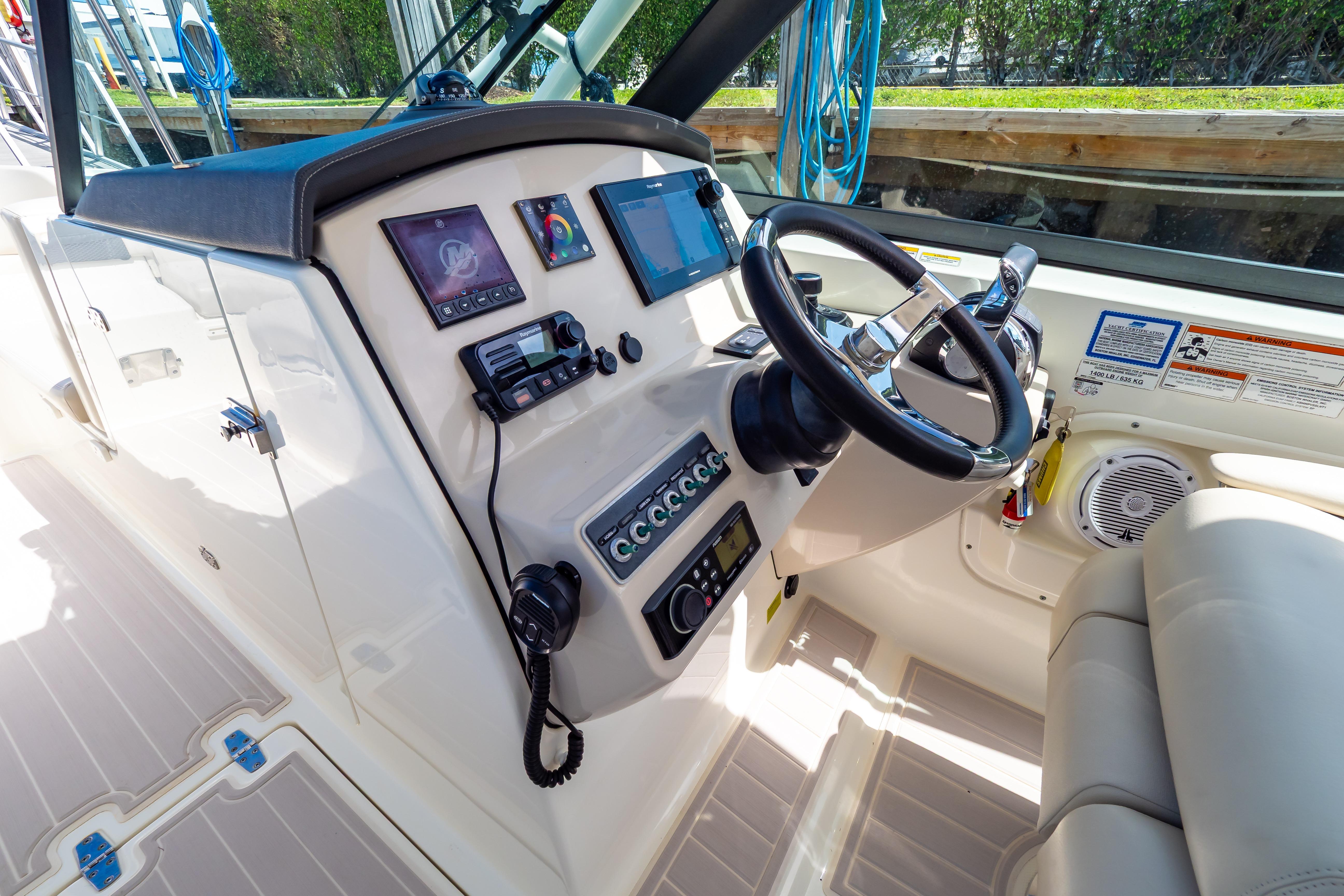 2019 Boston Whaler 270 Vantage helm with modern controls and navigation equipment.