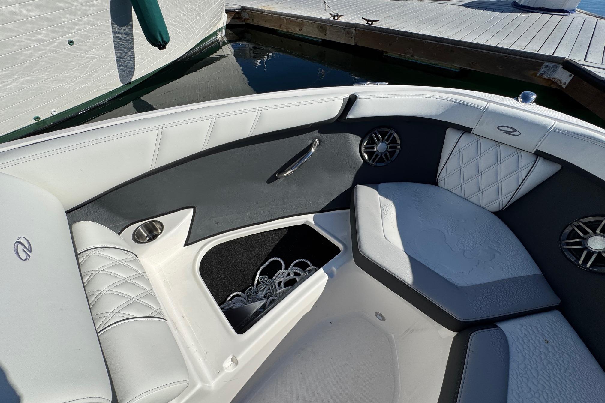 Interior of 2026 Regal 21 OBX boat with white and gray seating.