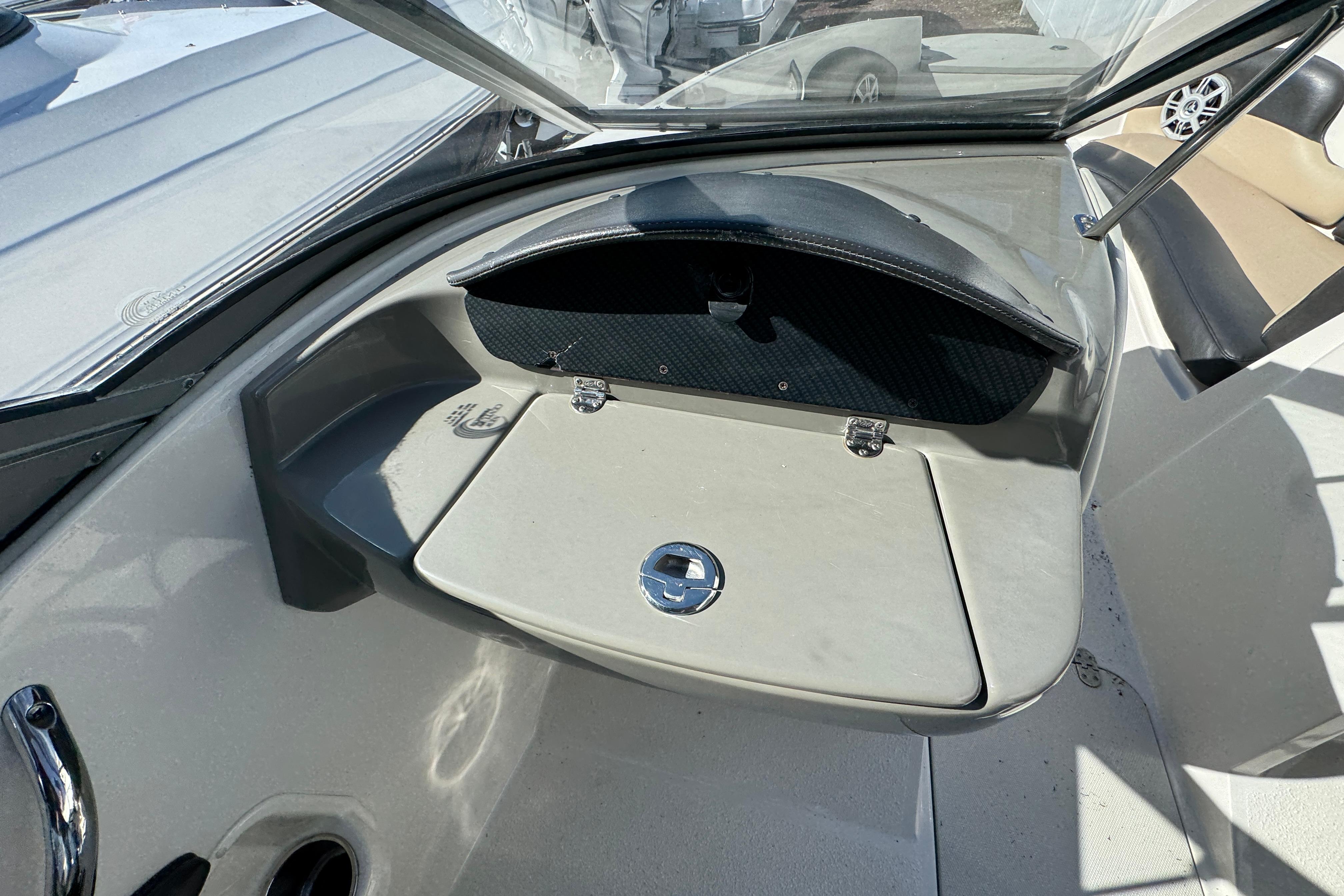 2018 Stingray 204 LR boat interior with open storage compartment and seating area.