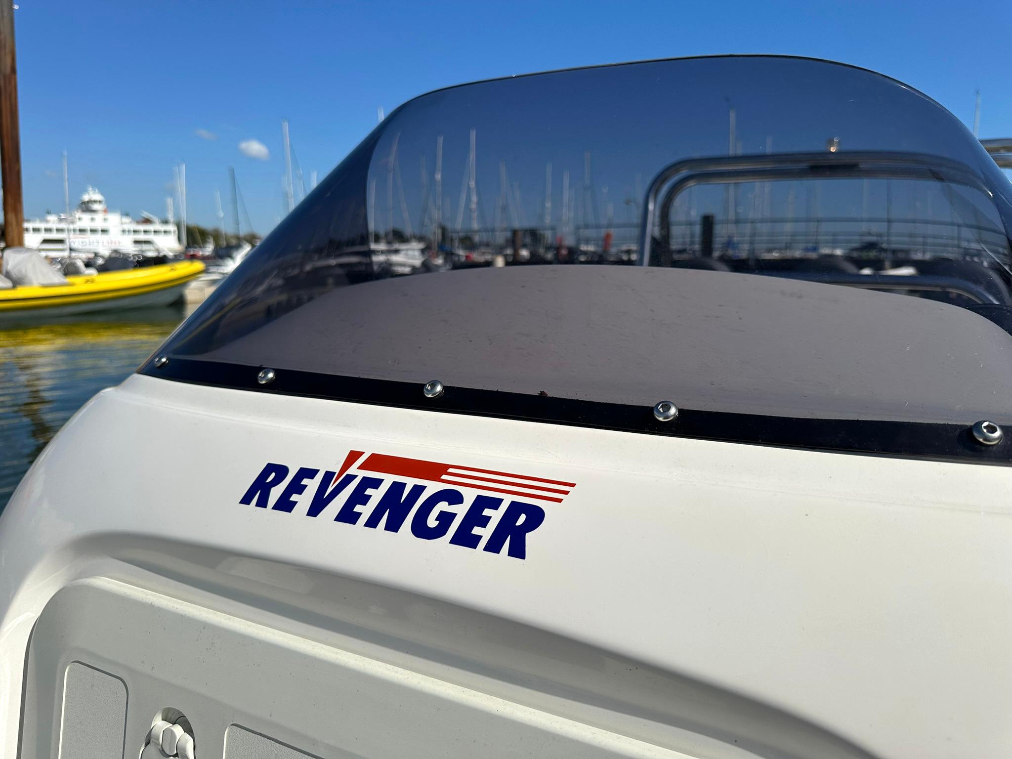 Revenger 715 boat, 2004 model, docked in a marina with clear blue skies.