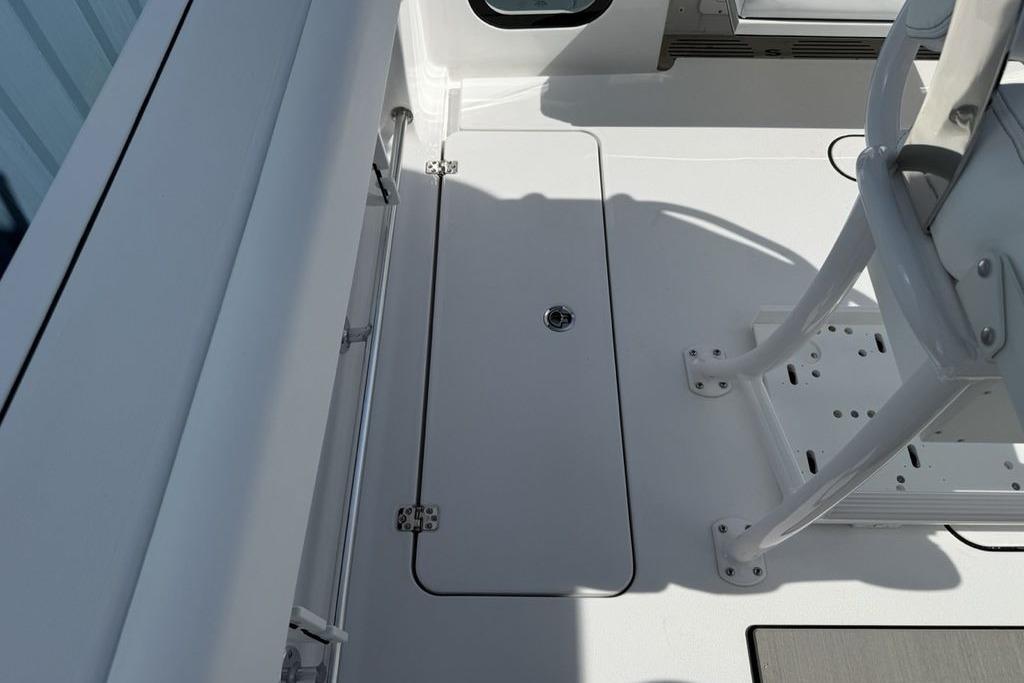 2026 Sportsman Open 252 Center Console boat interior, featuring sleek white deck design.