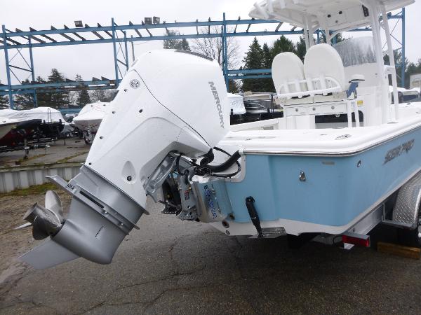 2025 Sea Pro 250 Bay boat with Mercury outboard motor, light blue hull.