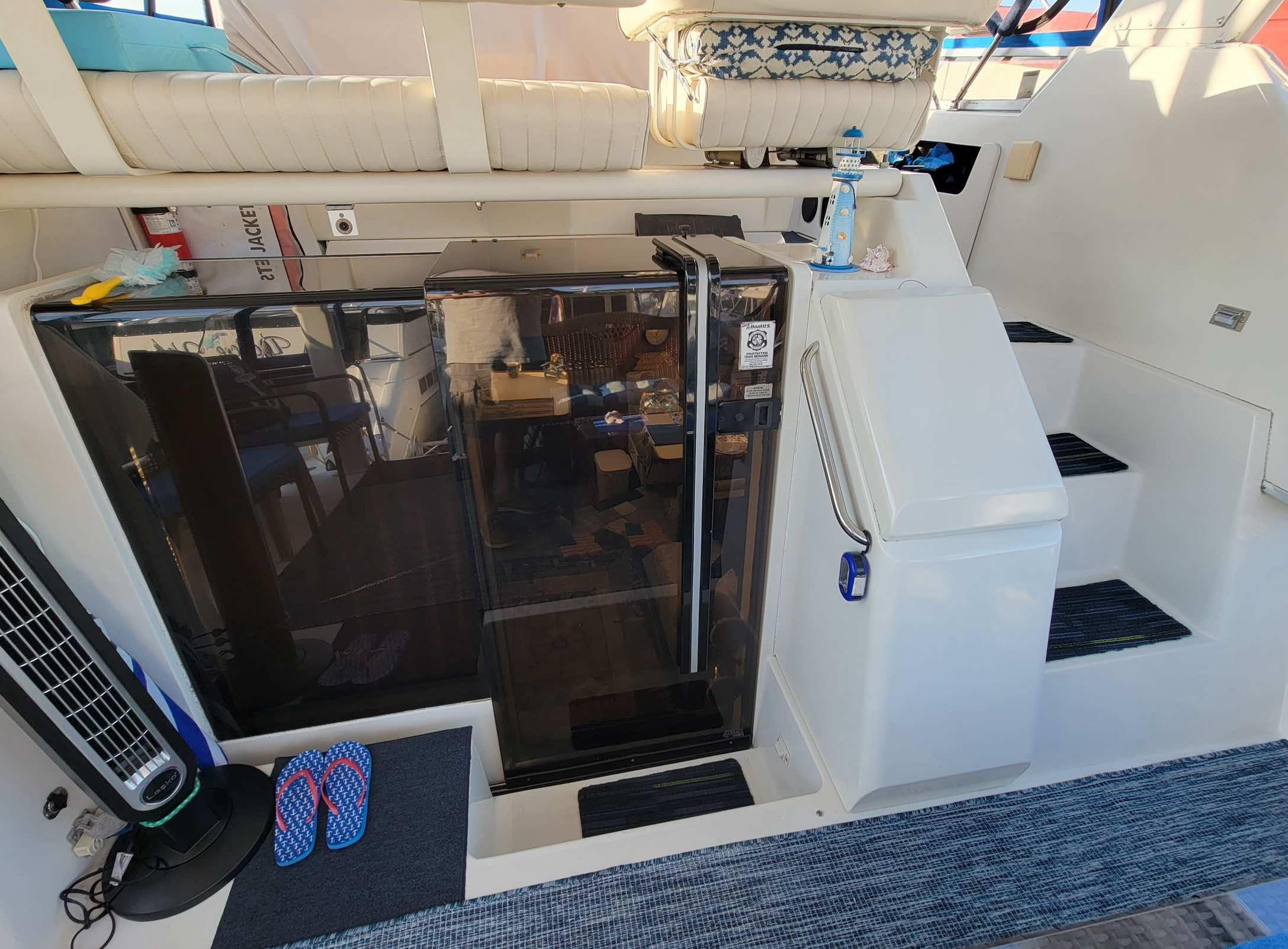 1992 Carver 33 Aft Cabin interior with stairs, seating, and nautical decor.
