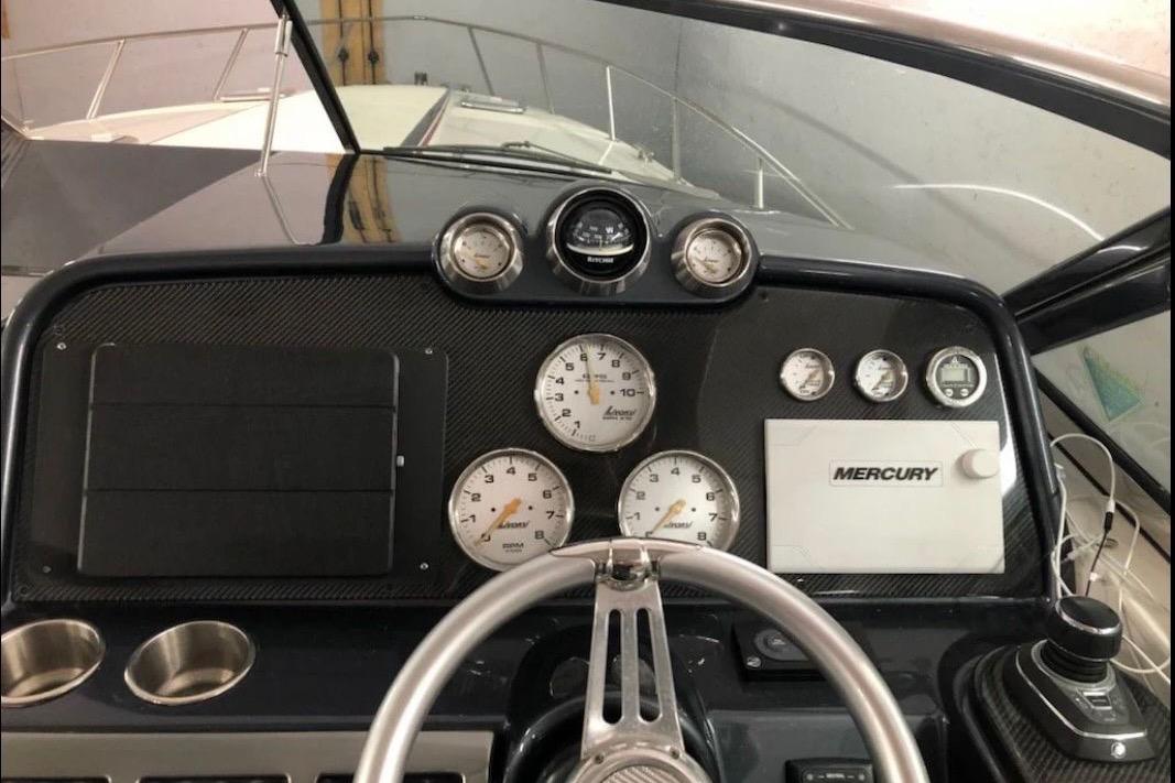 Dashboard of a 2017 Formula 370 Super Sport boat with Mercury controls and gauges.