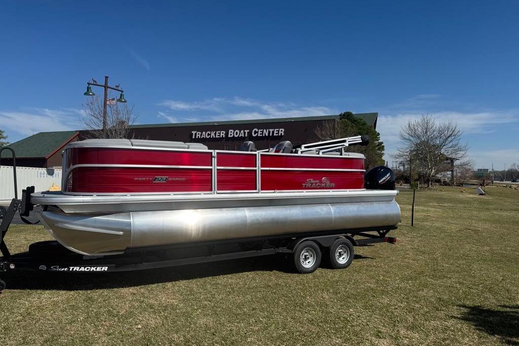 2026 Sun Tracker Party Barge 22 XP3 pontoon boat on trailer at Tracker Boat Center.