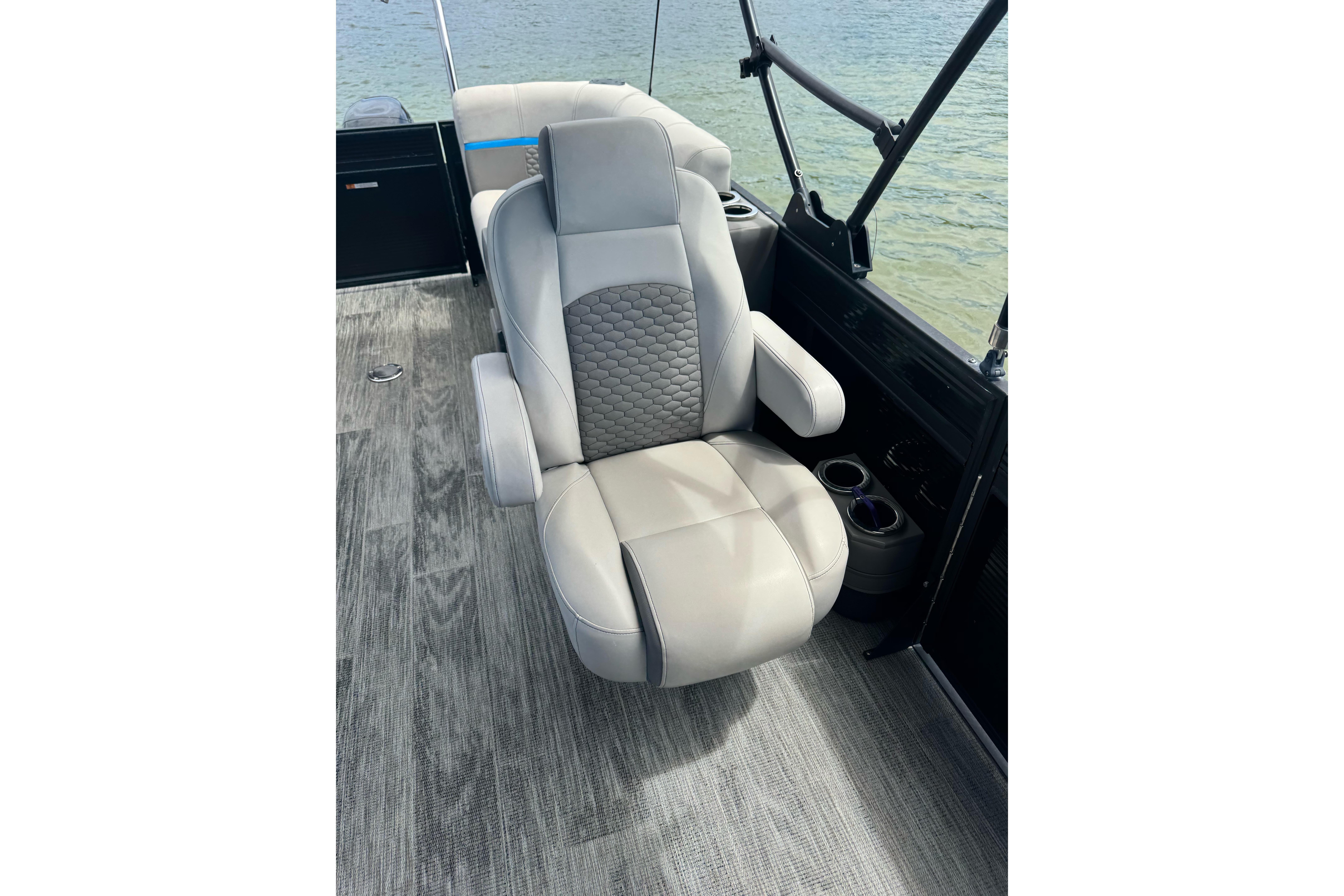 Luxurious seating on 2022 Qwest Edge 820 CTR boat, featuring elegant design and comfort.
