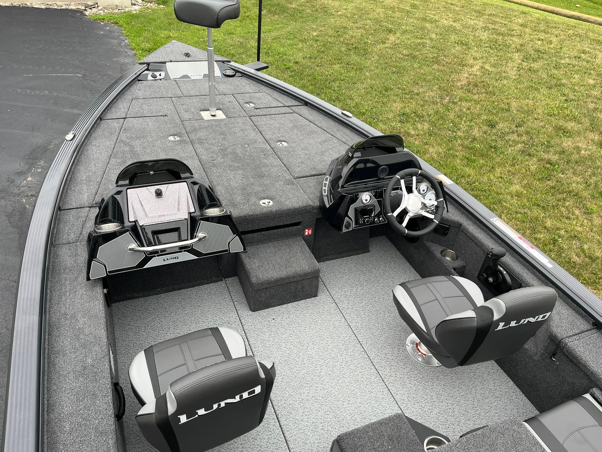 2026 Lund 1875 Pro-V Bass XS boat interior with steering console and seating.