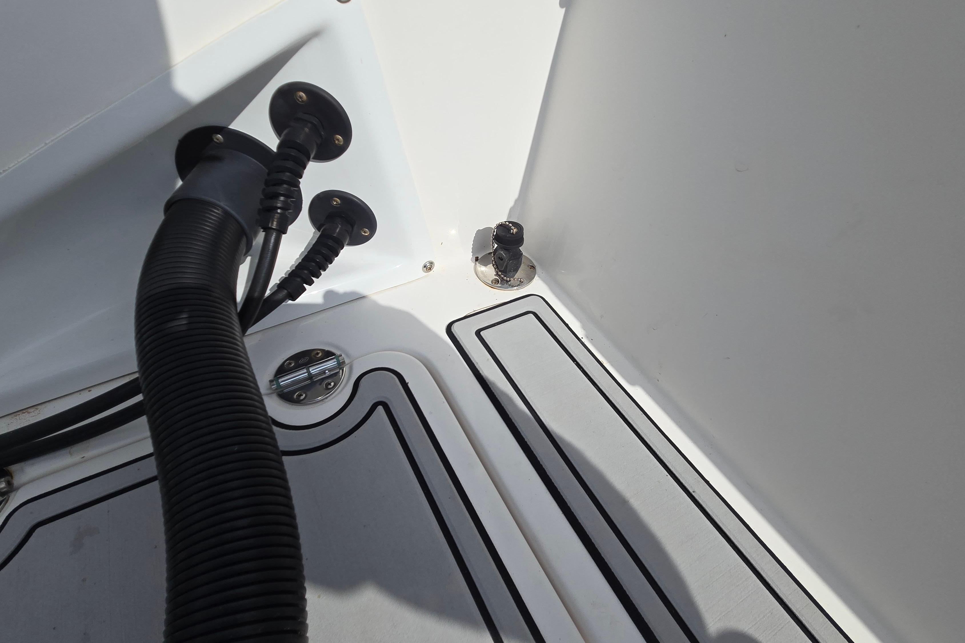 2020 Twin Vee 240 DC GF boat interior with hoses and fittings.