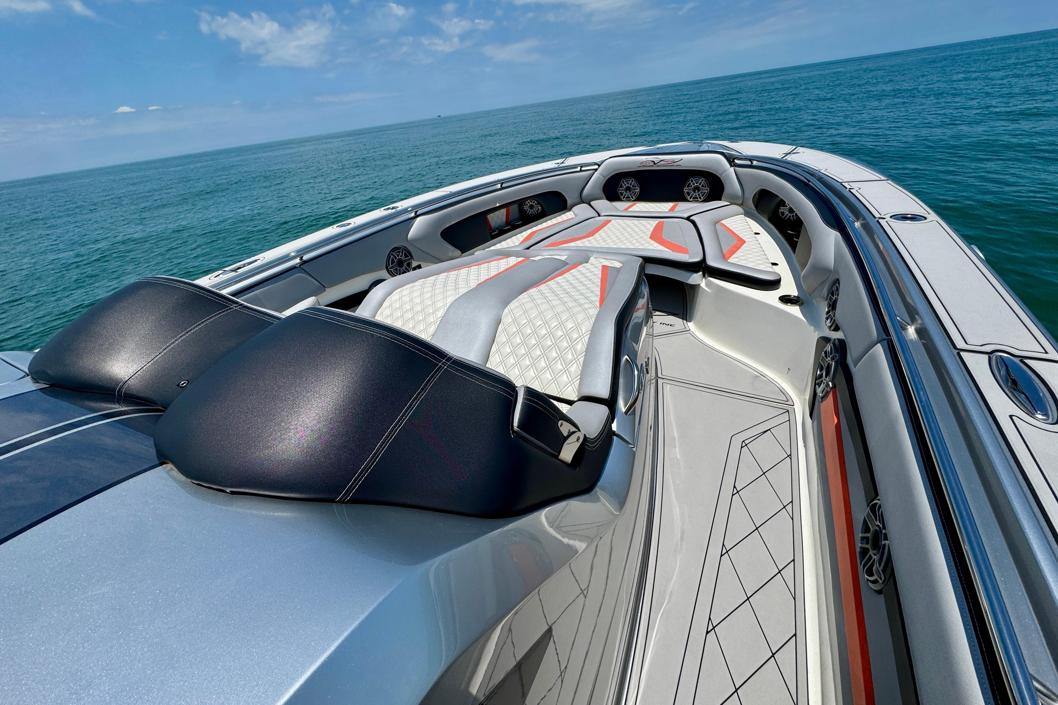 Luxurious 2017 MTI V42 boat interior with sleek seating on open water.
