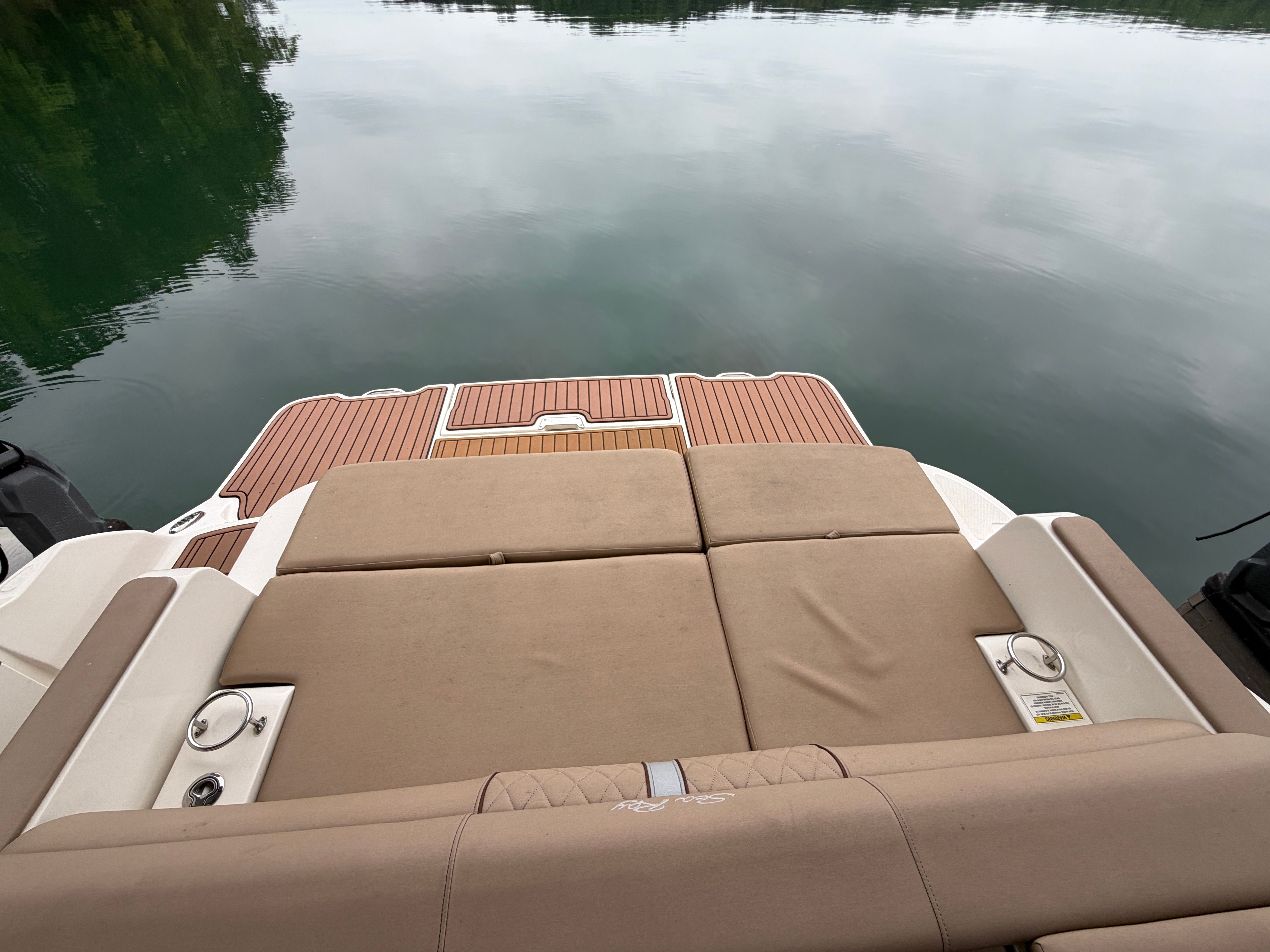 Rear view of 2016 Sea Ray 290 Sundeck on calm water.