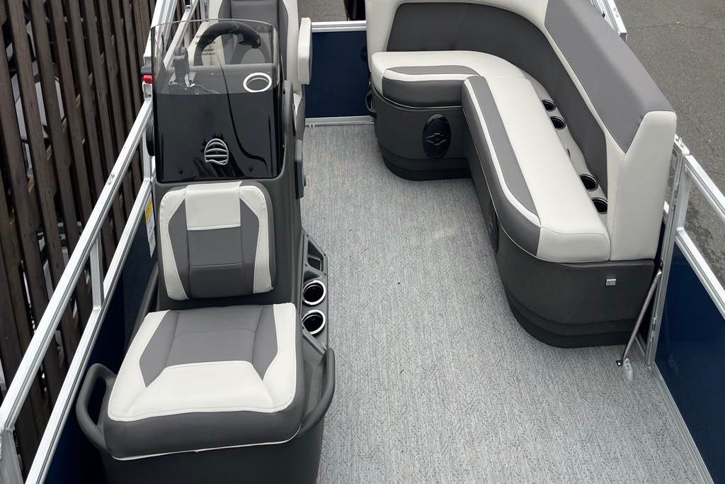 2026 Sun Tracker Bass Buggy 16 XL Select interior with gray seating and steering console.