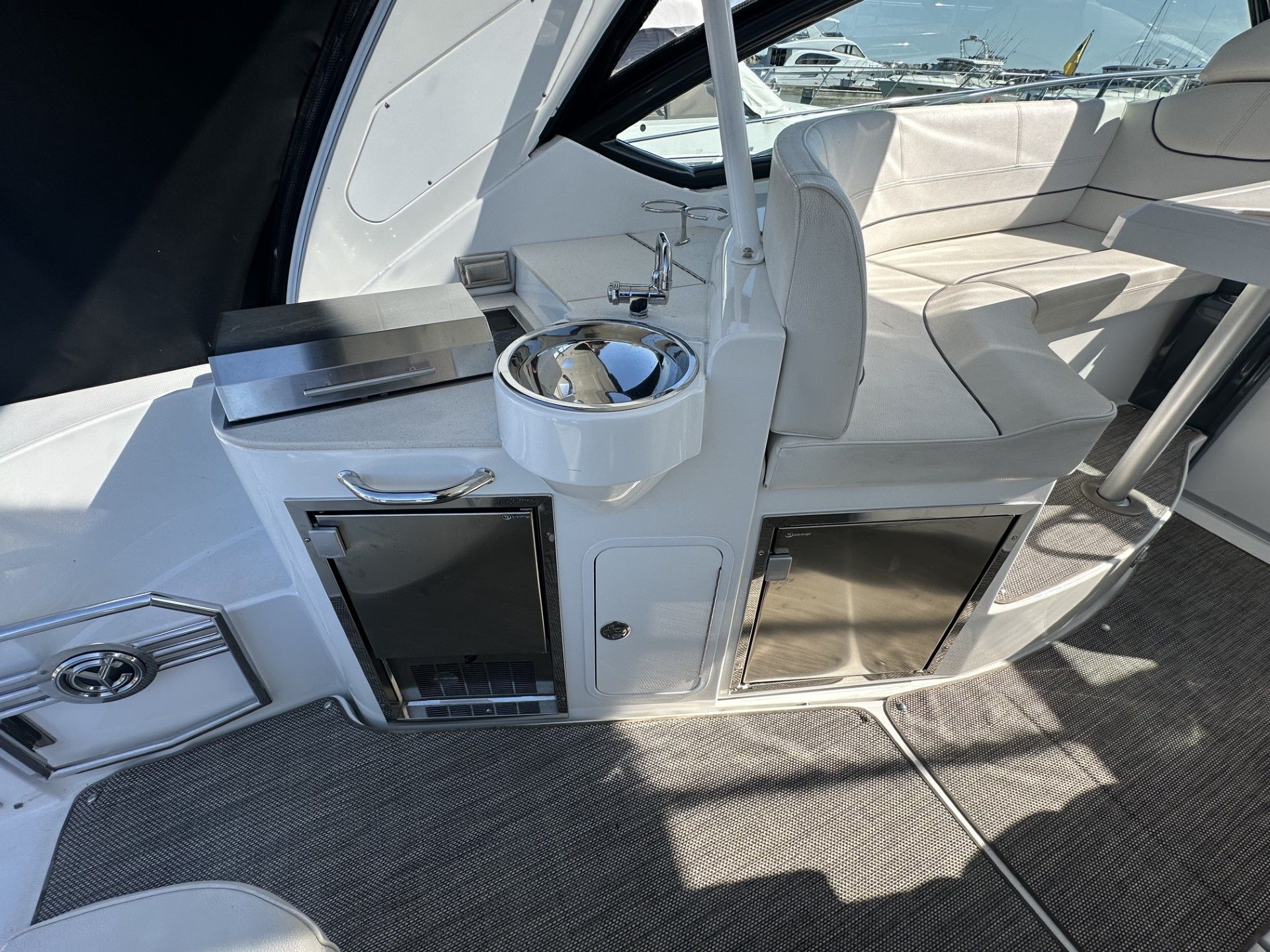 Interior of 2016 Cruisers Yachts 380 Express with seating and sink area.