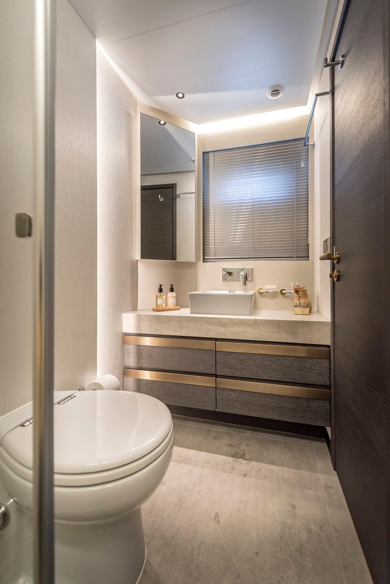Luxurious bathroom in 2025 Numarine 26XP yacht with modern fixtures and elegant design.