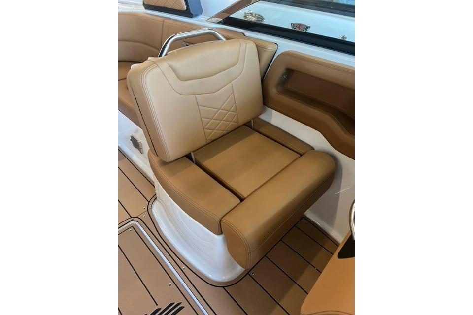 2025 Chaparral 247 SSX boat seat with tan leather upholstery and modern design.