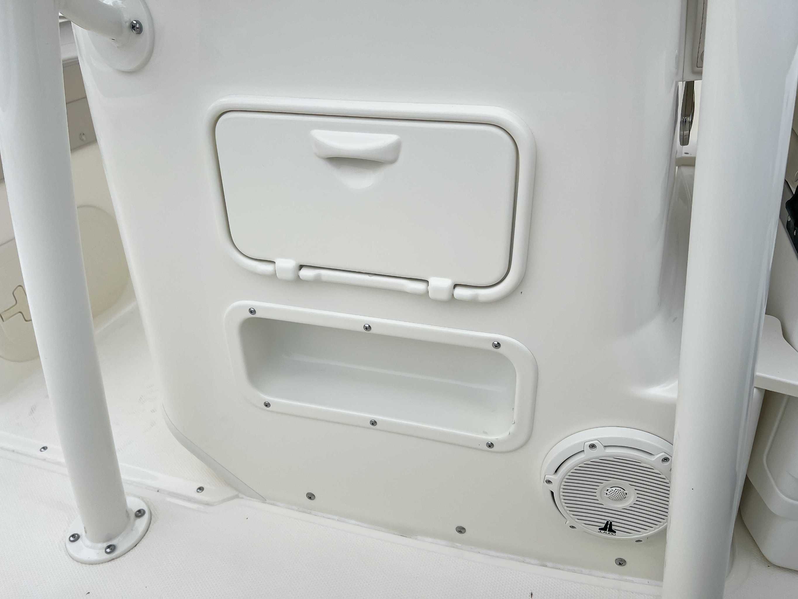 Interior of 2025 Boston Whaler 190 Montauk with storage and speaker.