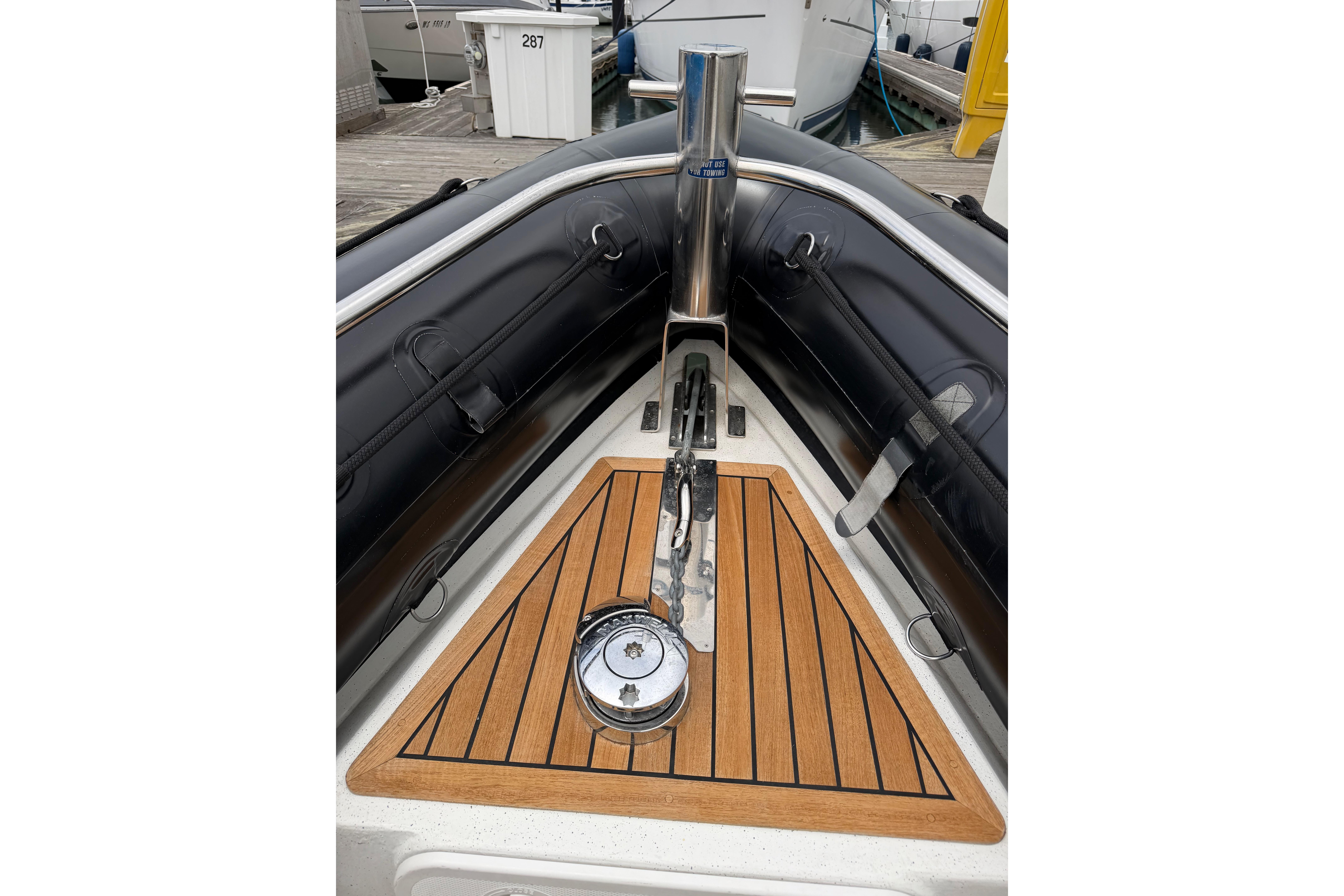 2016 Protector Targa 30 boat bow with teak decking and anchor system.