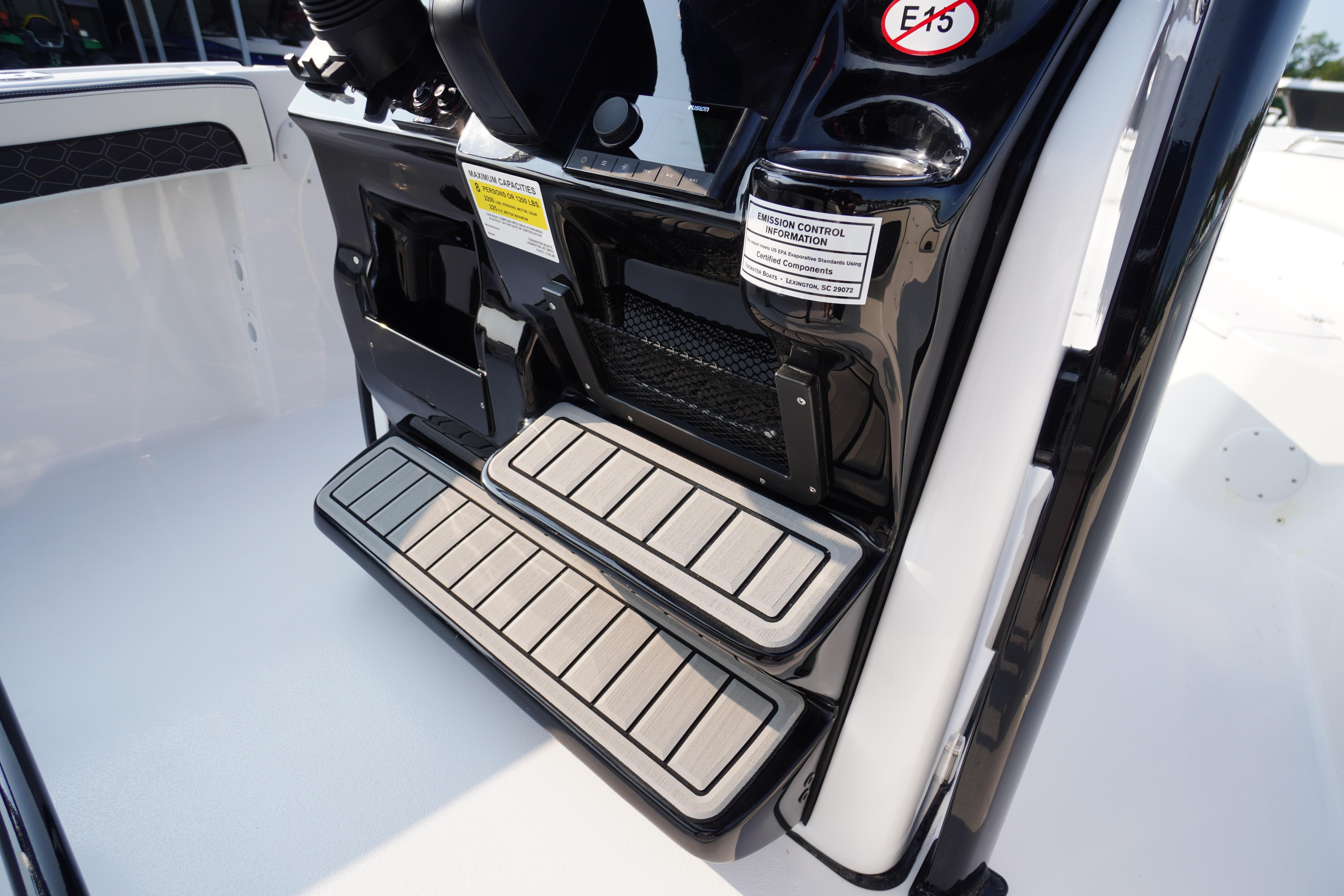 2026 Tidewater 210 LXF boat steps with emission control information label.
